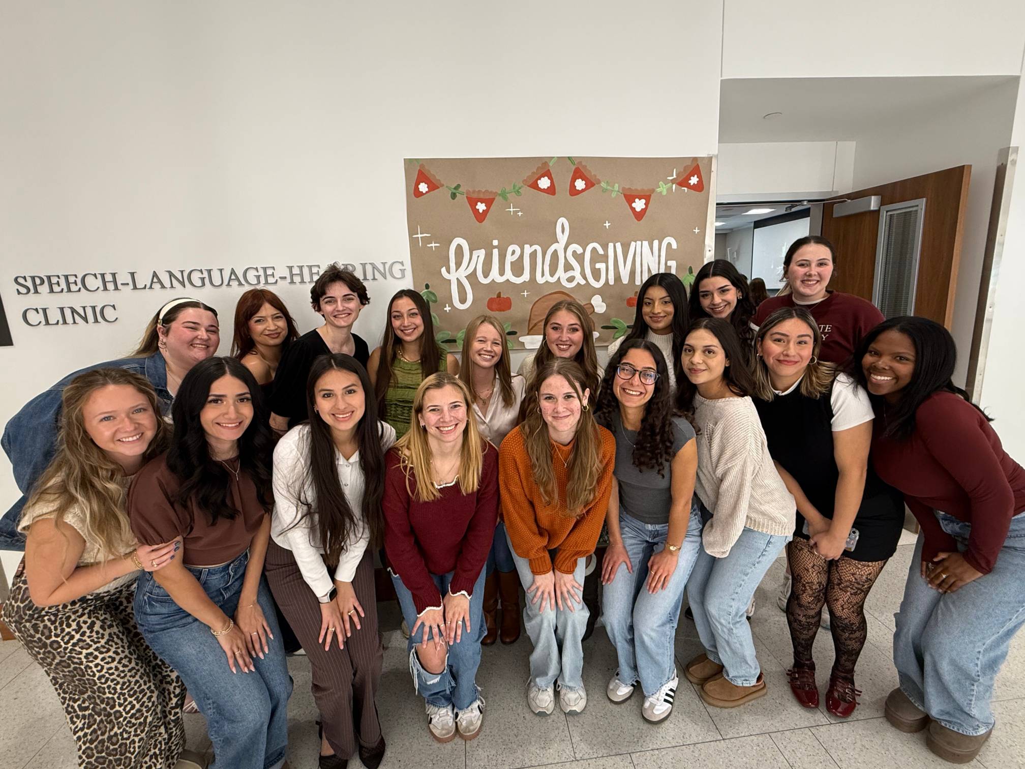 A group of CDIS students posing during the Friendsgiving event.