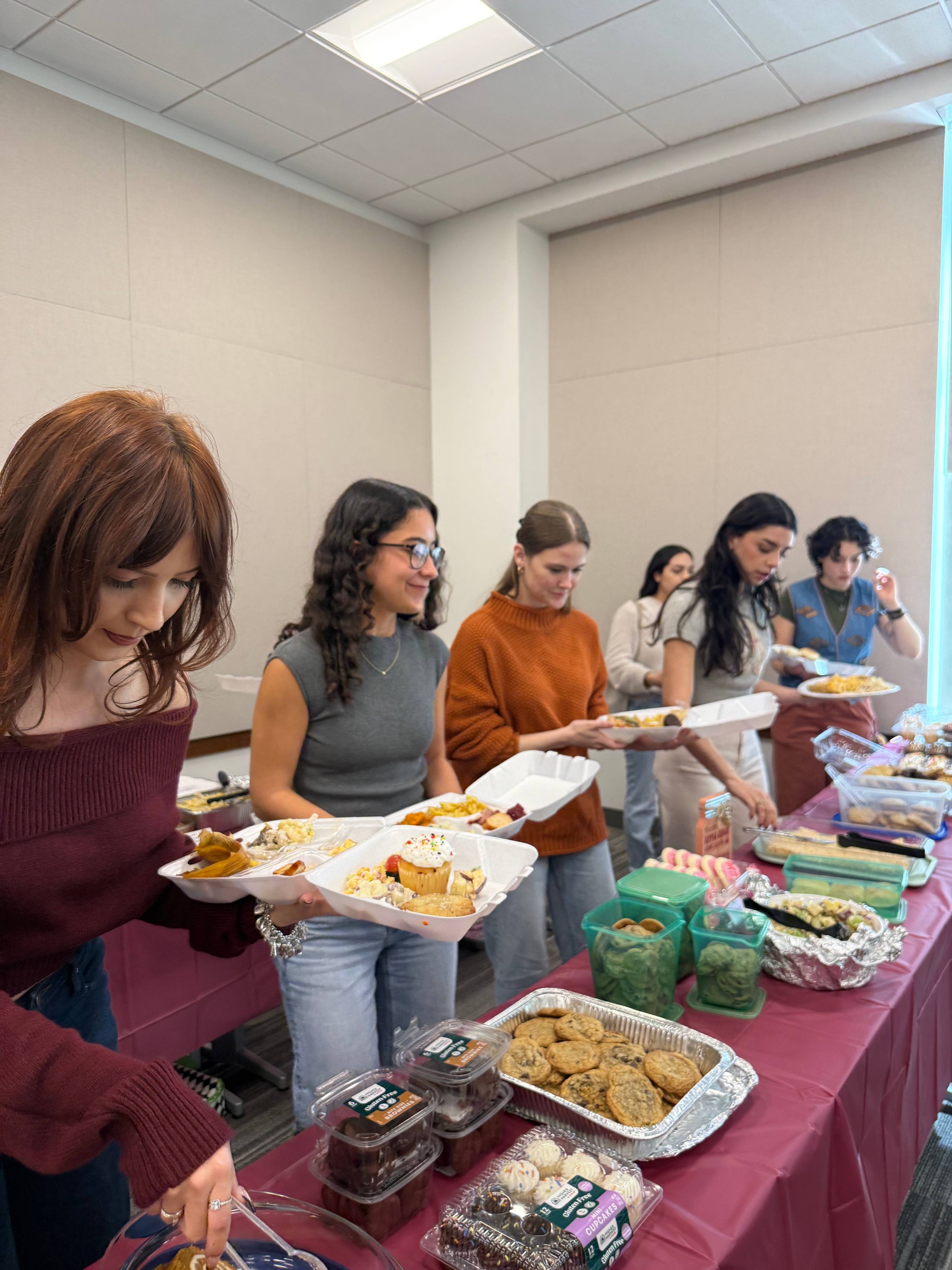 Students grabbing food during the event.