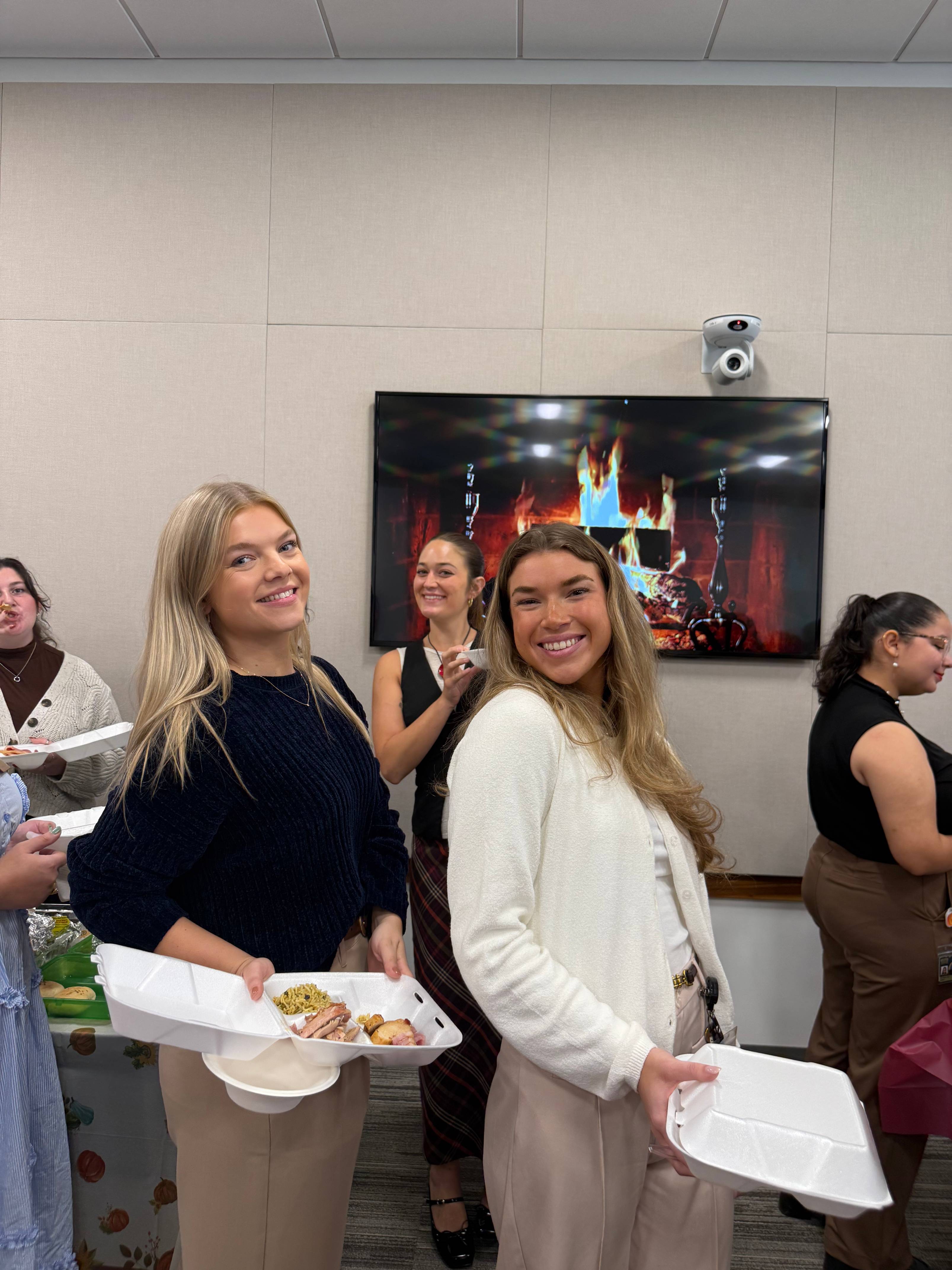 CDIS students grabbing food.