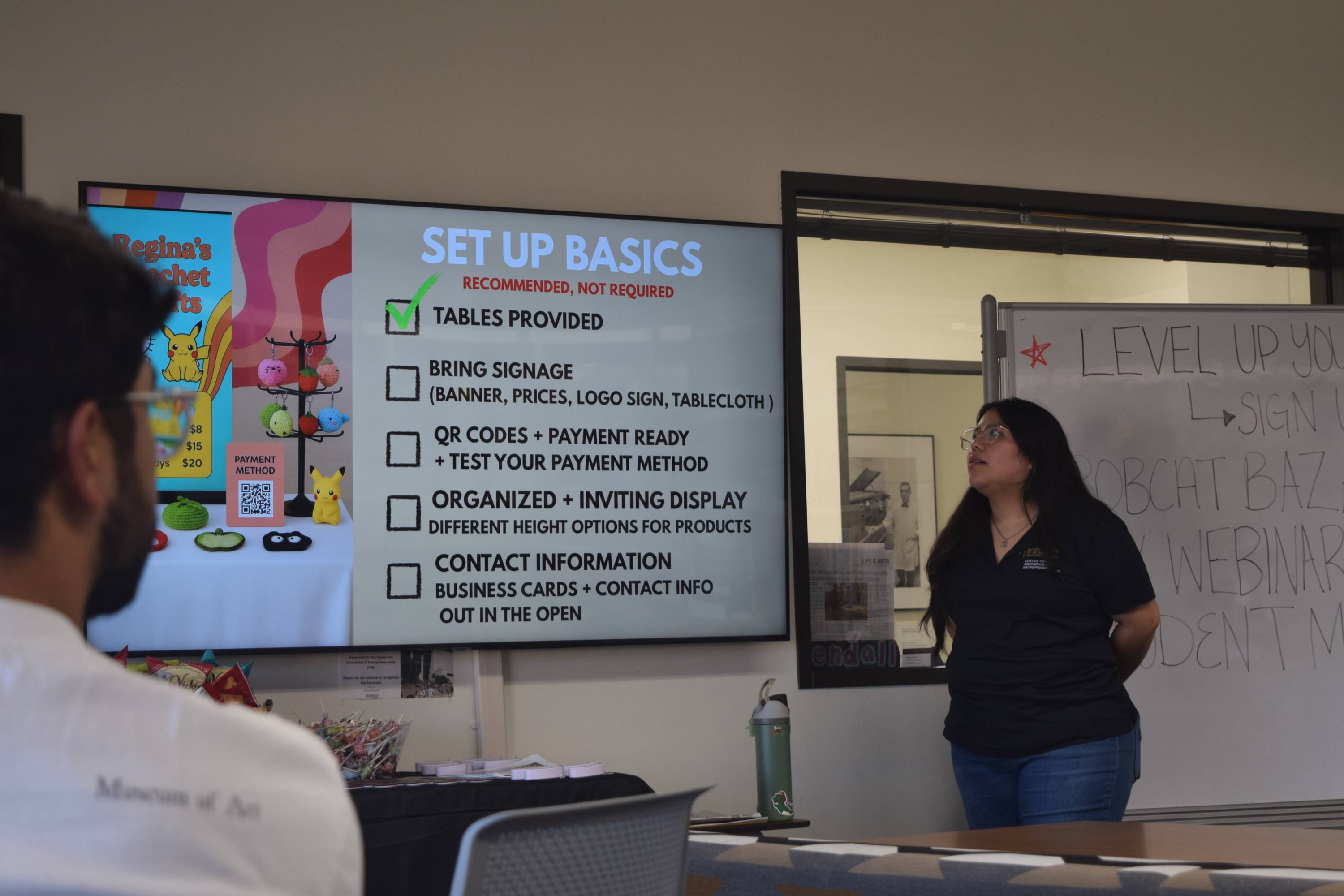 Regina Bautista teaches a group of students at a vendoring wednesday workshop. Bautista provided tips and tricks on how to become a vendor with Bobcat Bazaar and how to be successful.