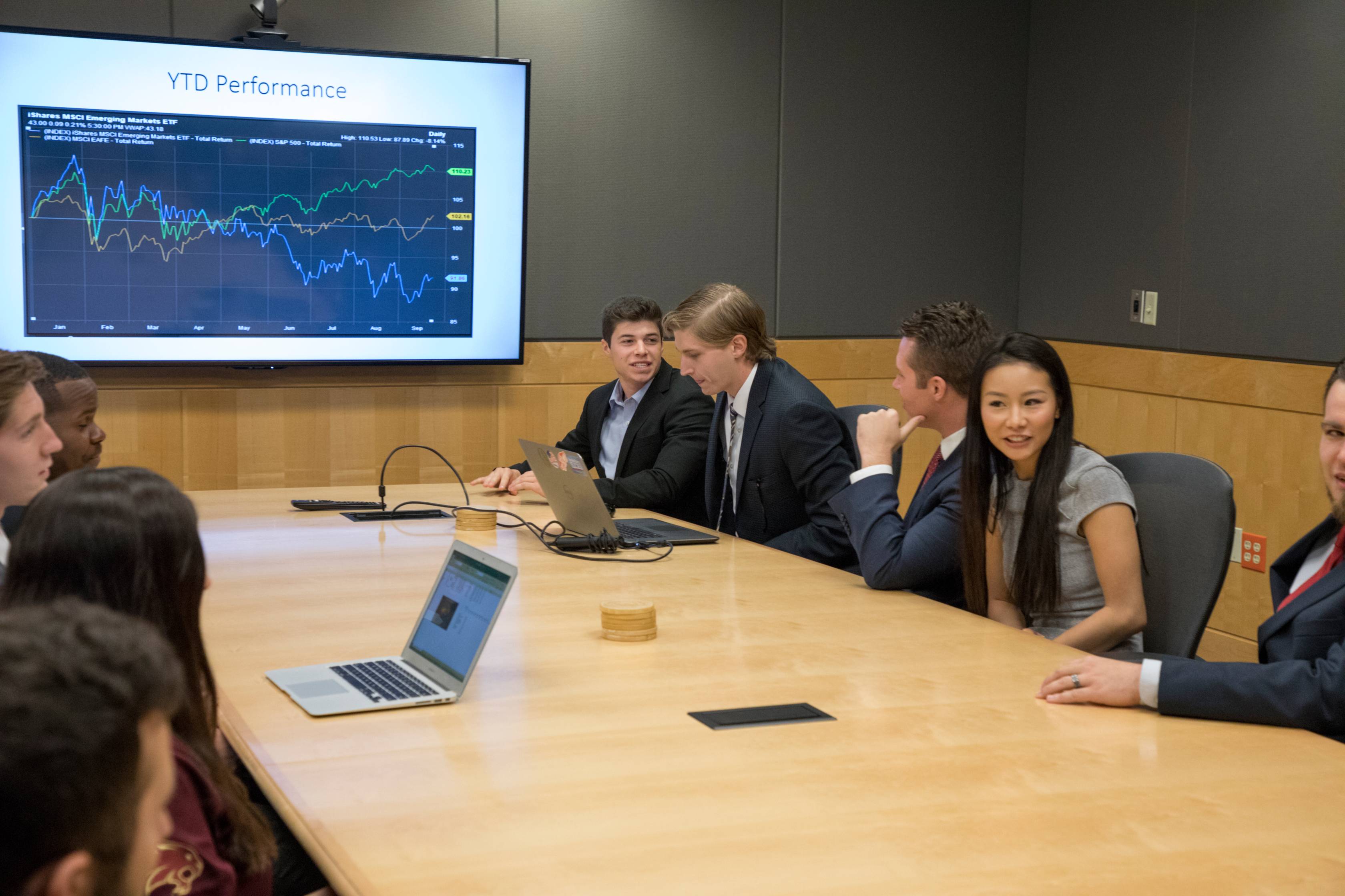 man and woman in front of a research poster