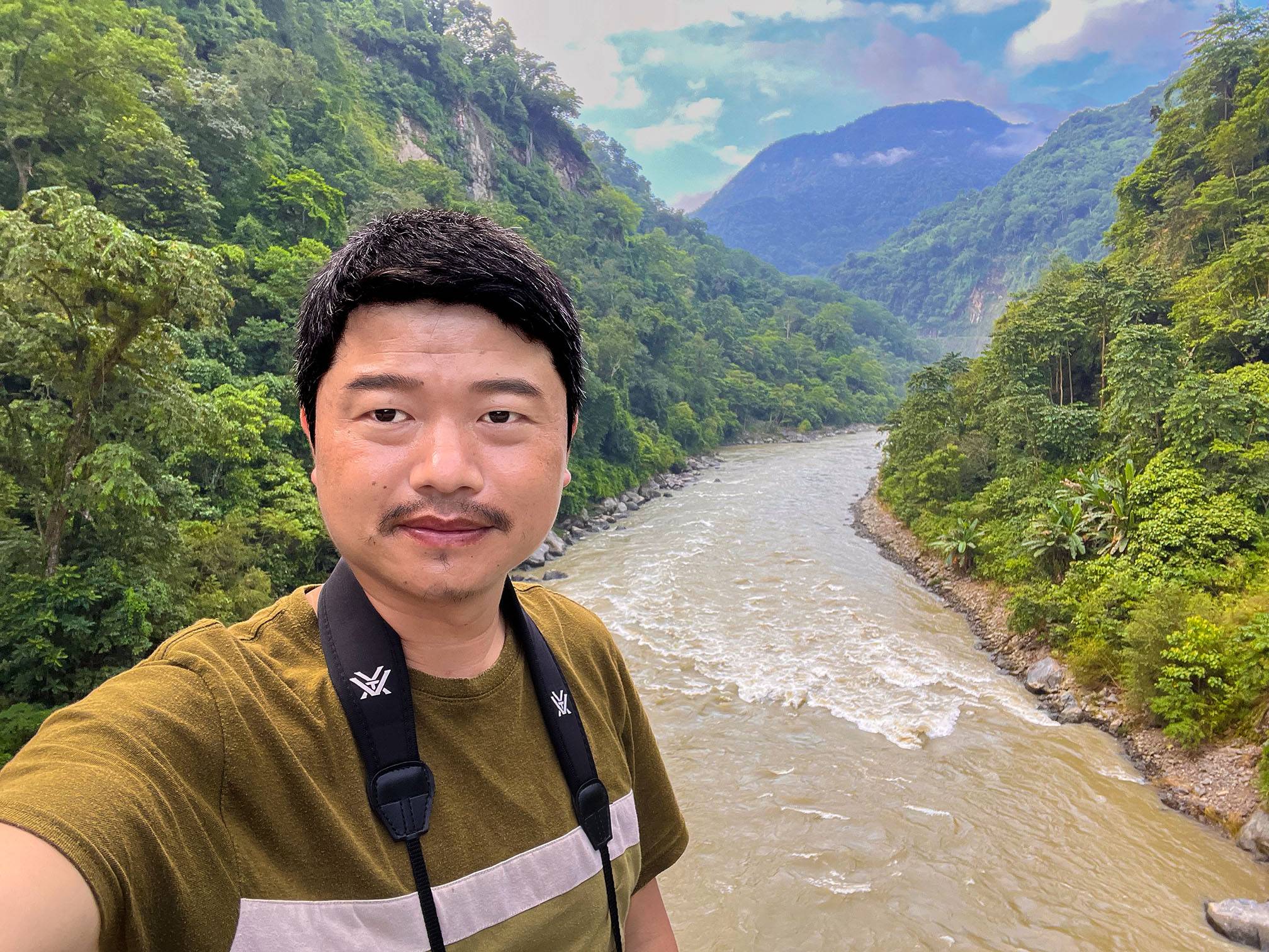Headshot of Pema Khandu in a valley.