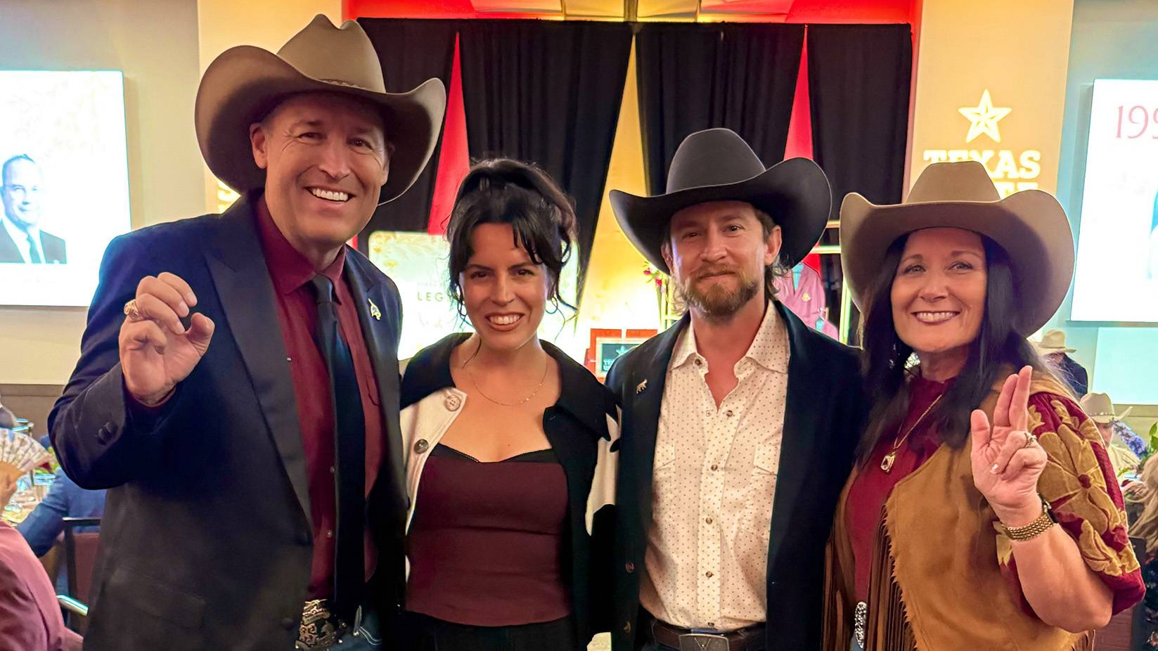 President Damphousse (left) poses for a photo with two honorees at the DA Gala and First Lady Damphousse.