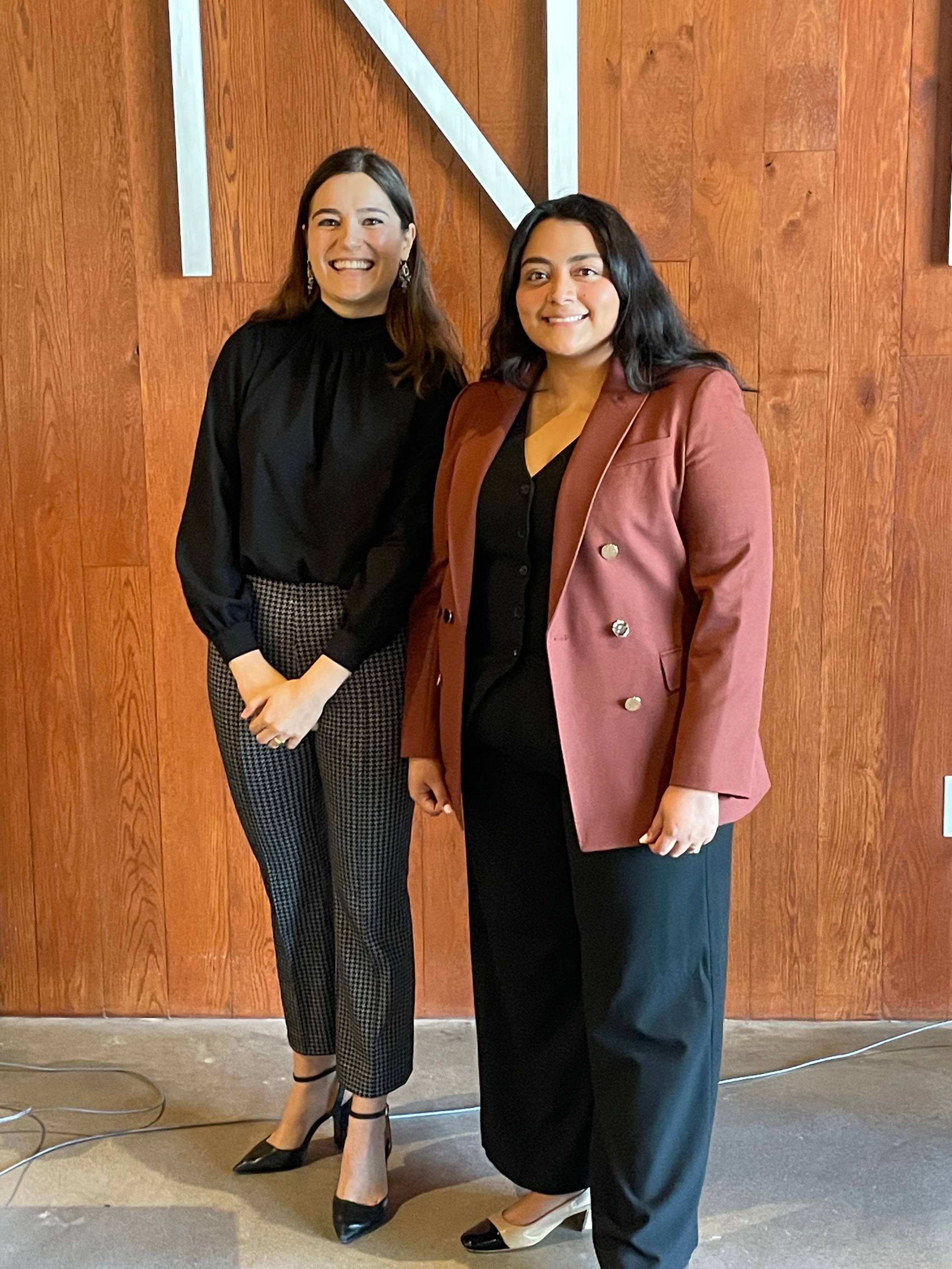 two members smiling to the camera