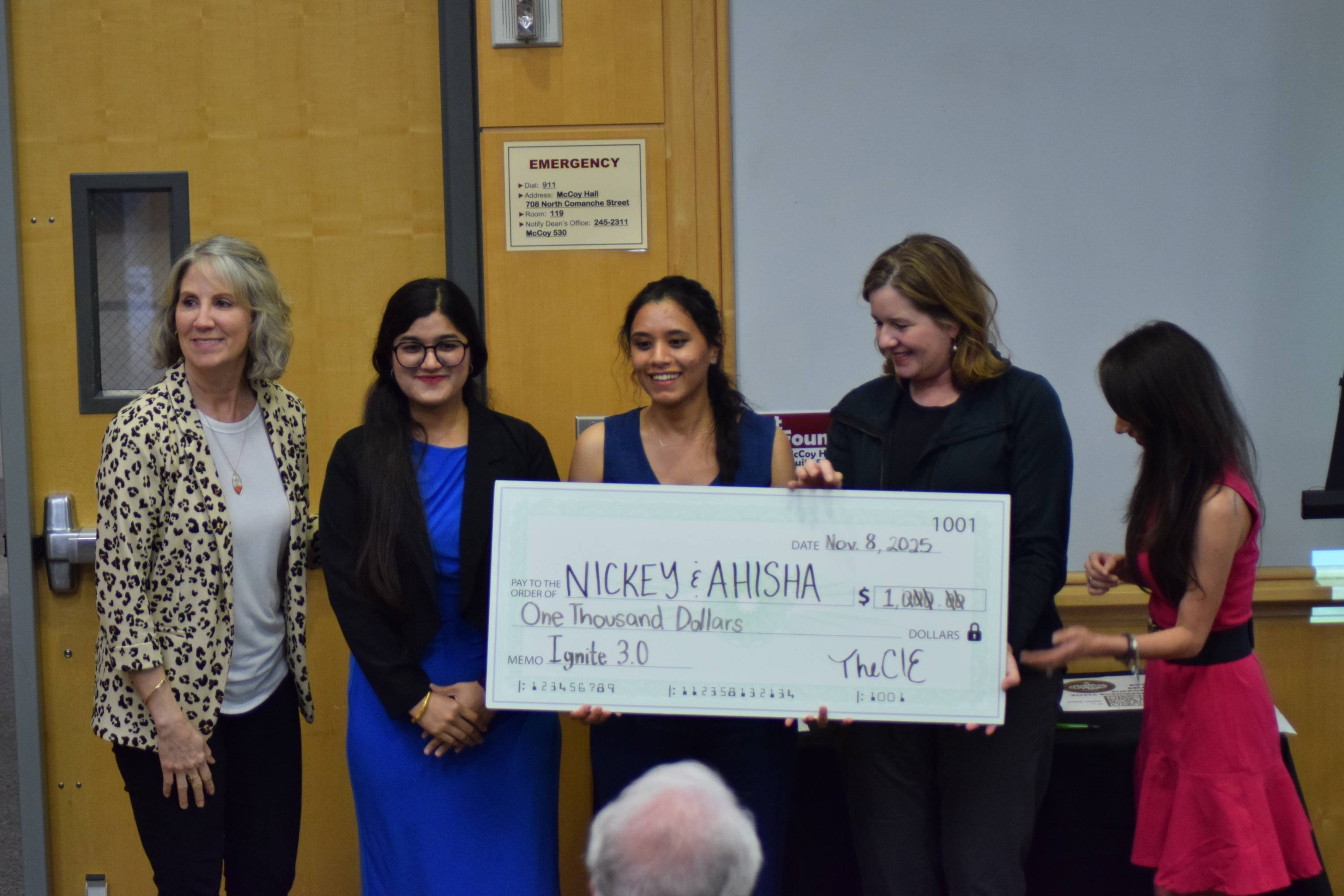 Nicky Thakurathi and Atisha Karki posing with judges after being awarded first place at the Ignite 3.0 pitch competition.