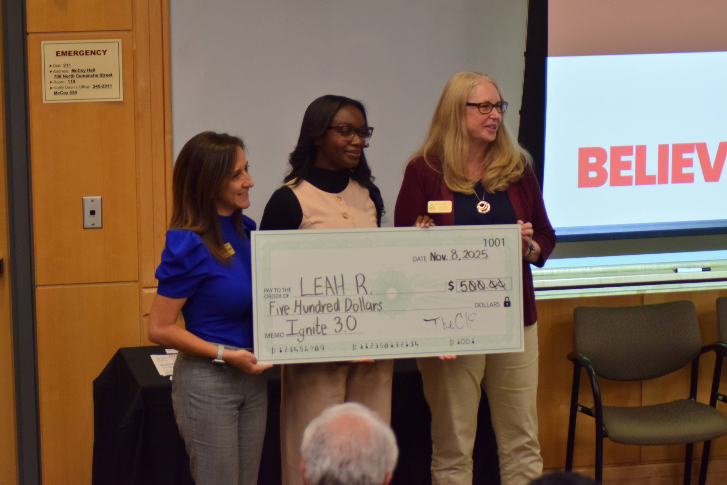 Leah Rose posing for a photo with the judges after being awarded second place for Group A at the pitch competition at Ignite 3.0.