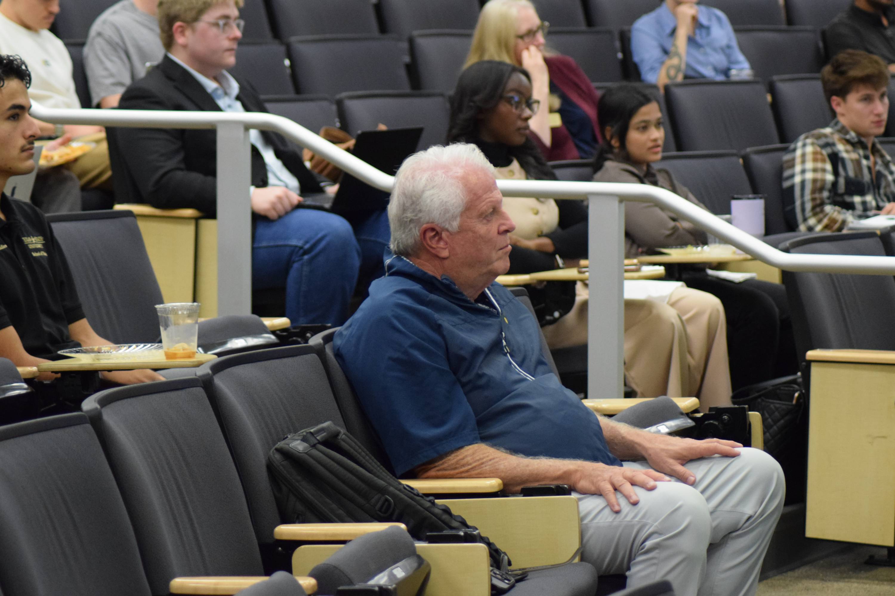 A man listens to presentations at Ignite 3.0.