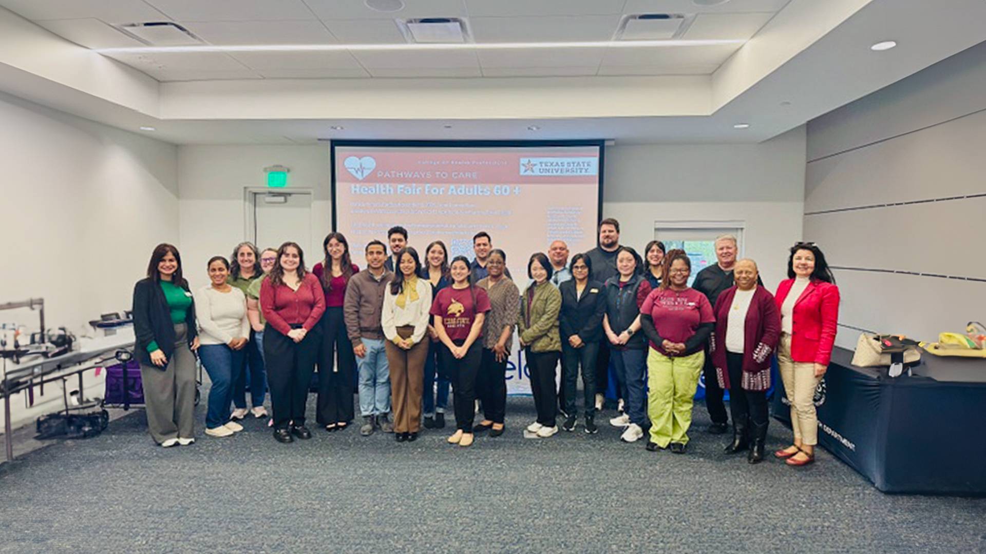 A group of students and faculty members at a research conference