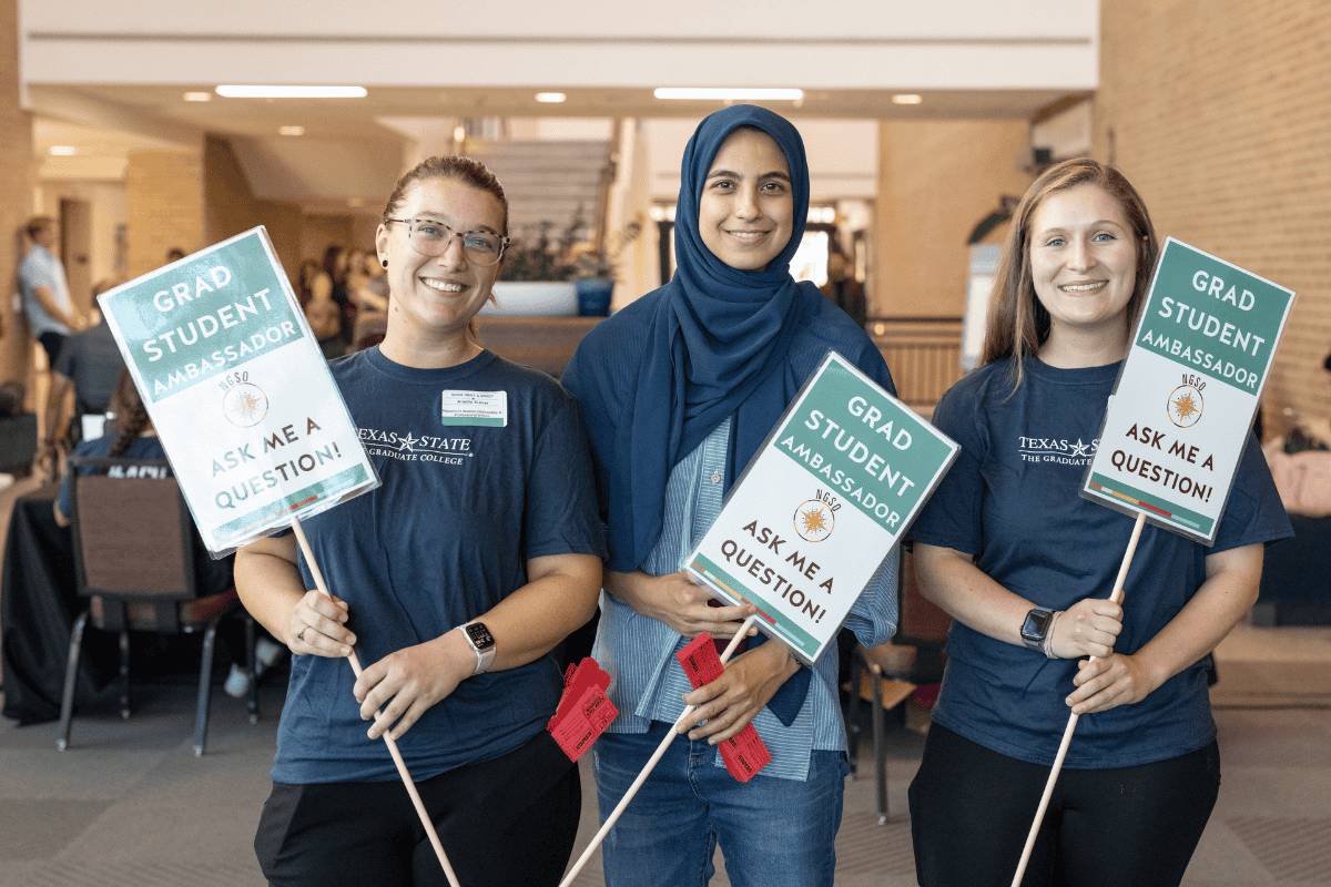A professor guiding a student in class.