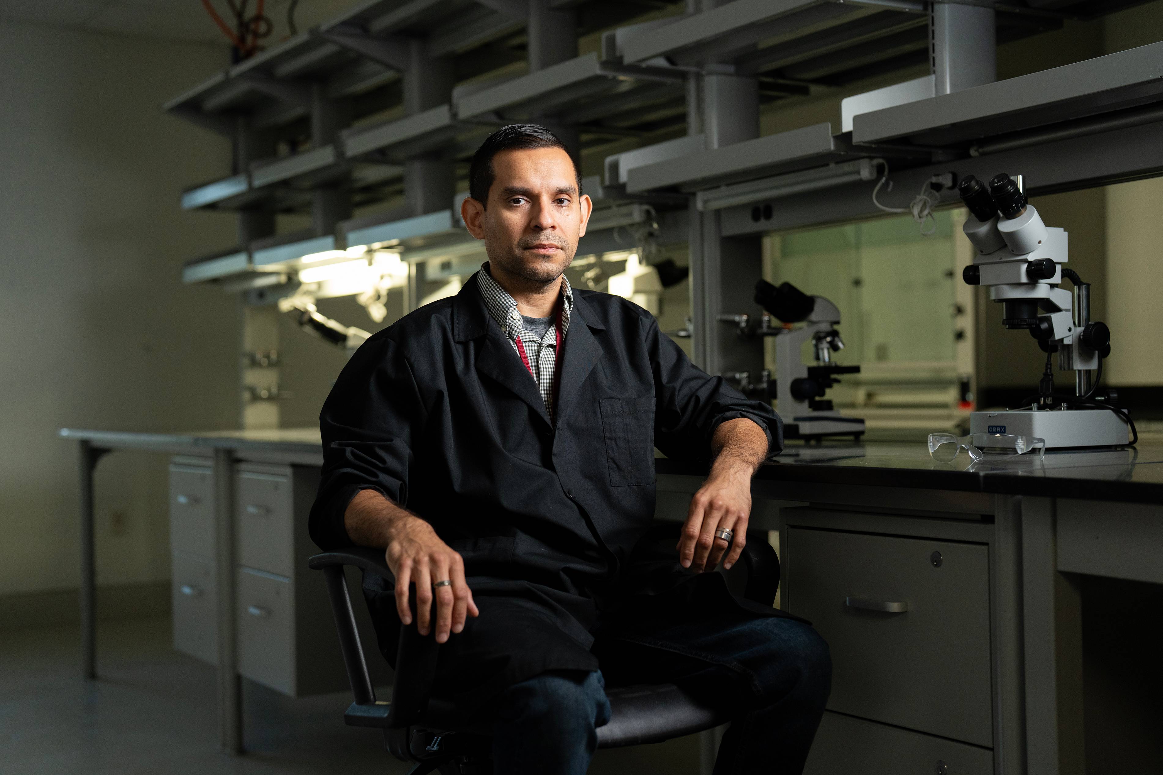 chris reyes sitting in lab setting