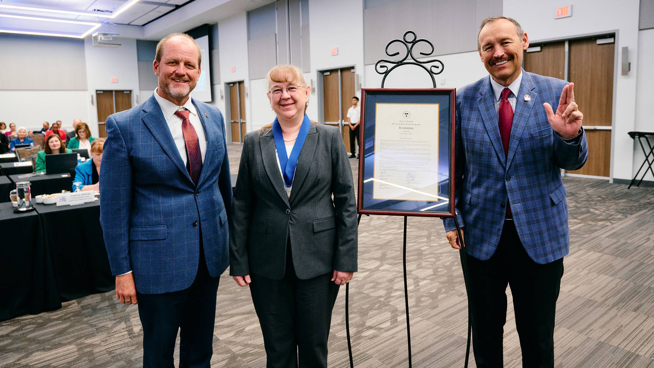 Morey and President Damphousse pose for a photo.