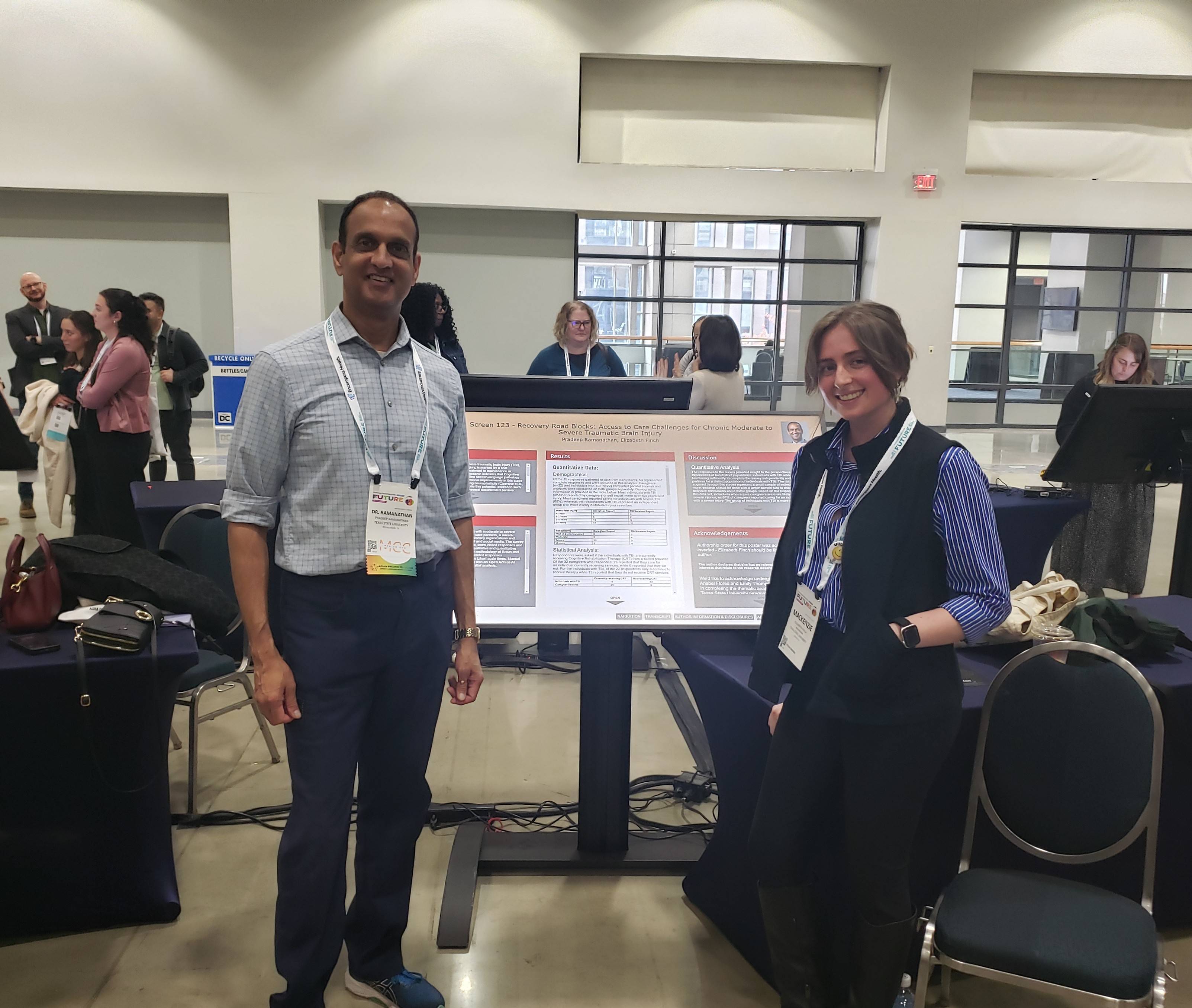 Dr. Ramanathan and CDIS student Elizabeth Finch standing next to the poster they presented.