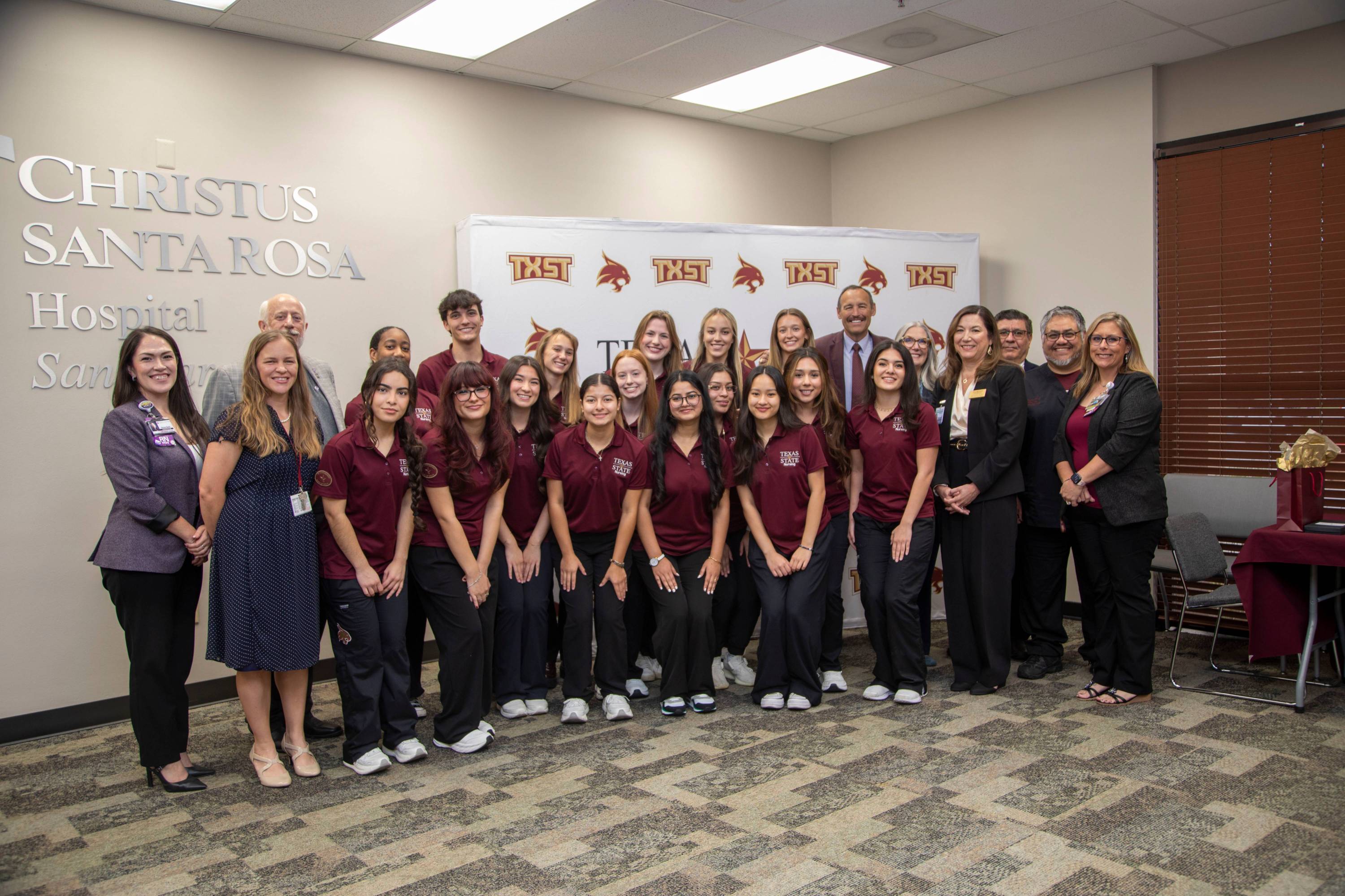 TXST and Christus Health leadership pose with nursing students