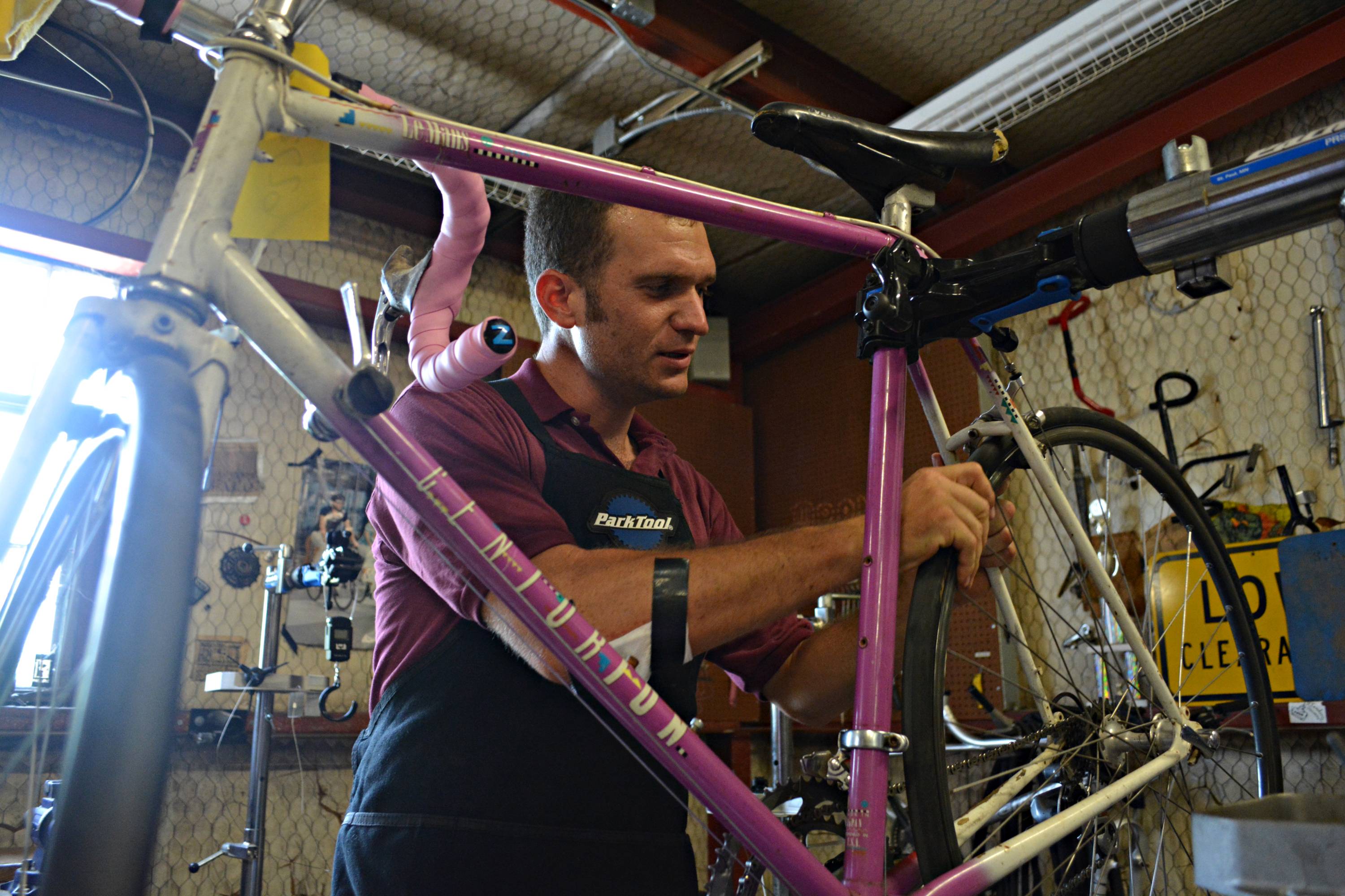 man providing maintenance on a bike 