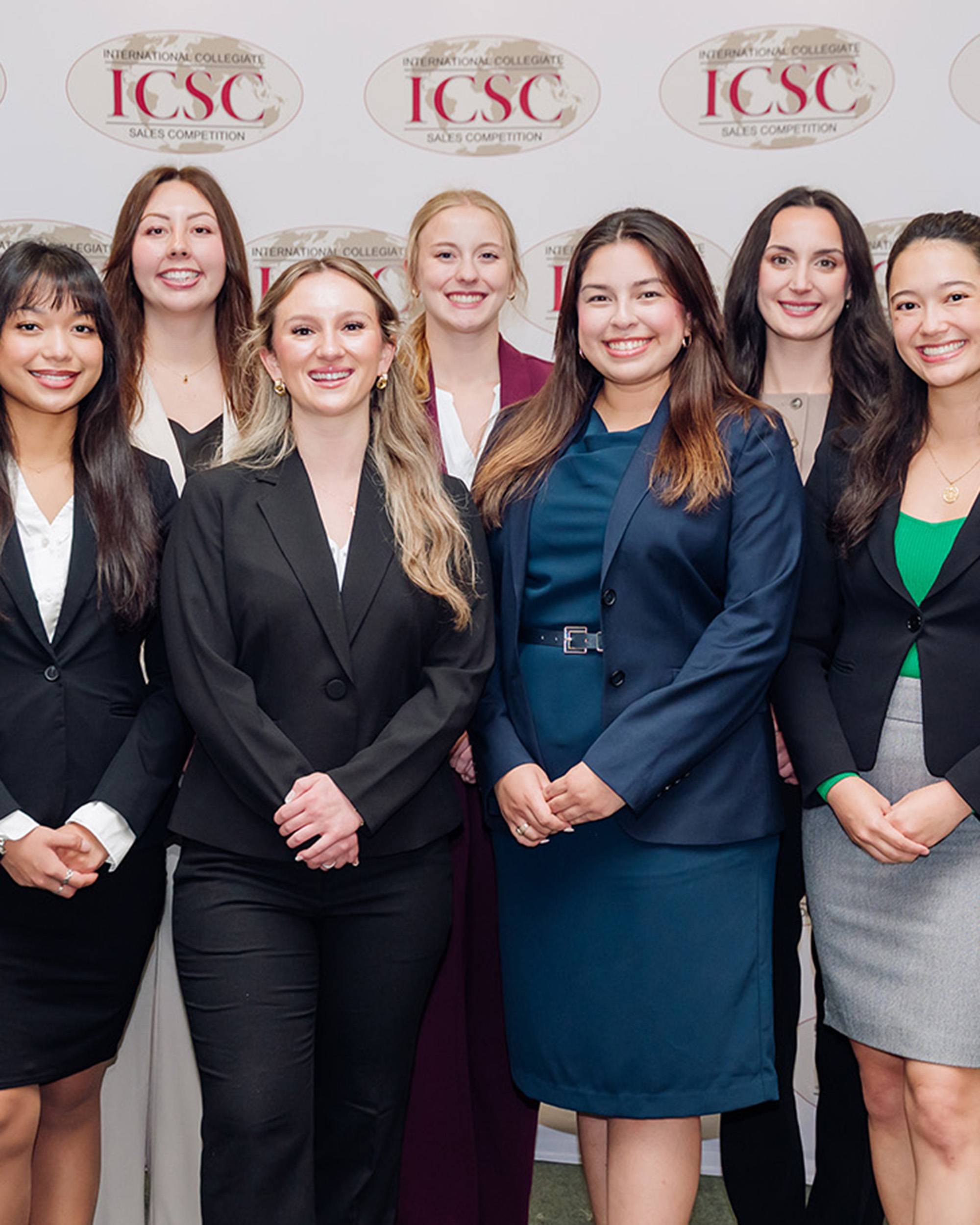 Young women posing in business attire