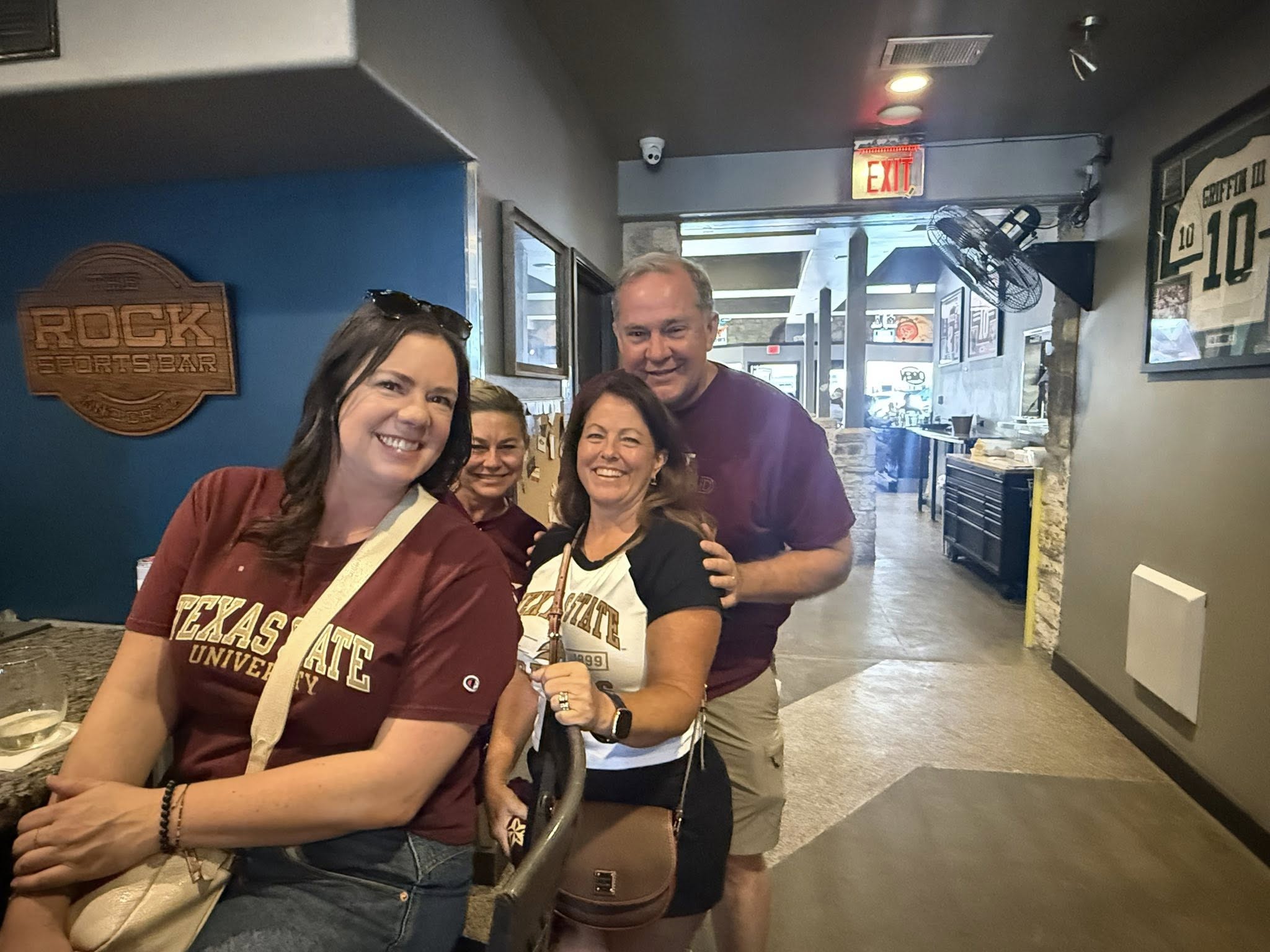 a group of fans smiling