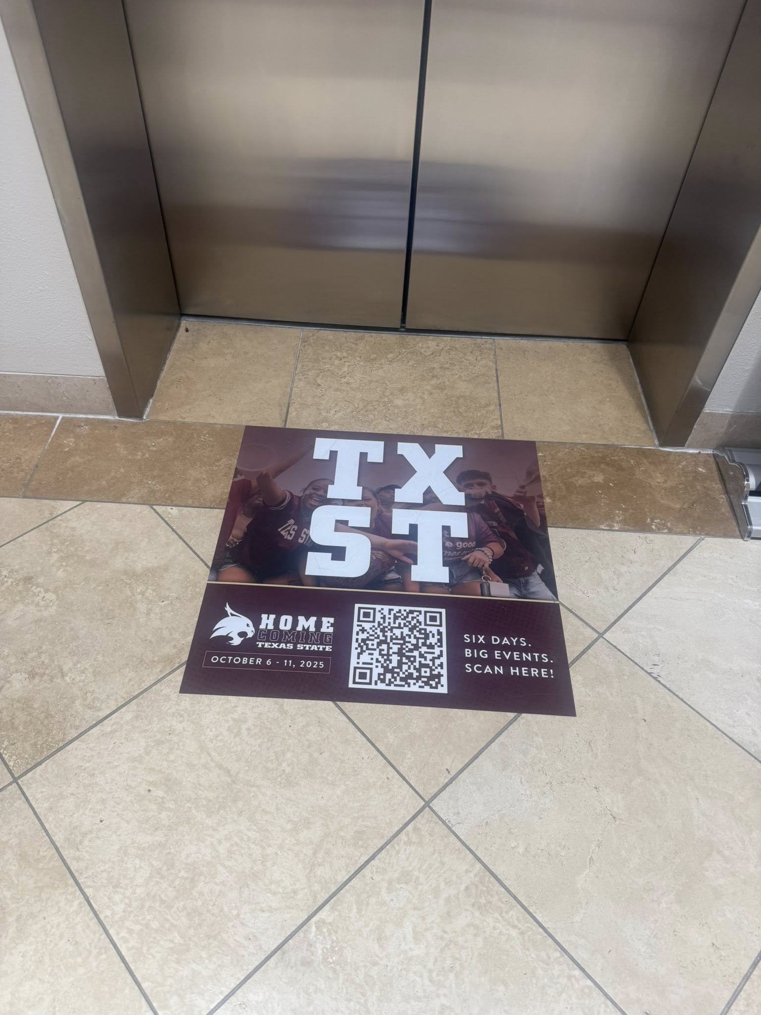 Event QR sign by the elevator