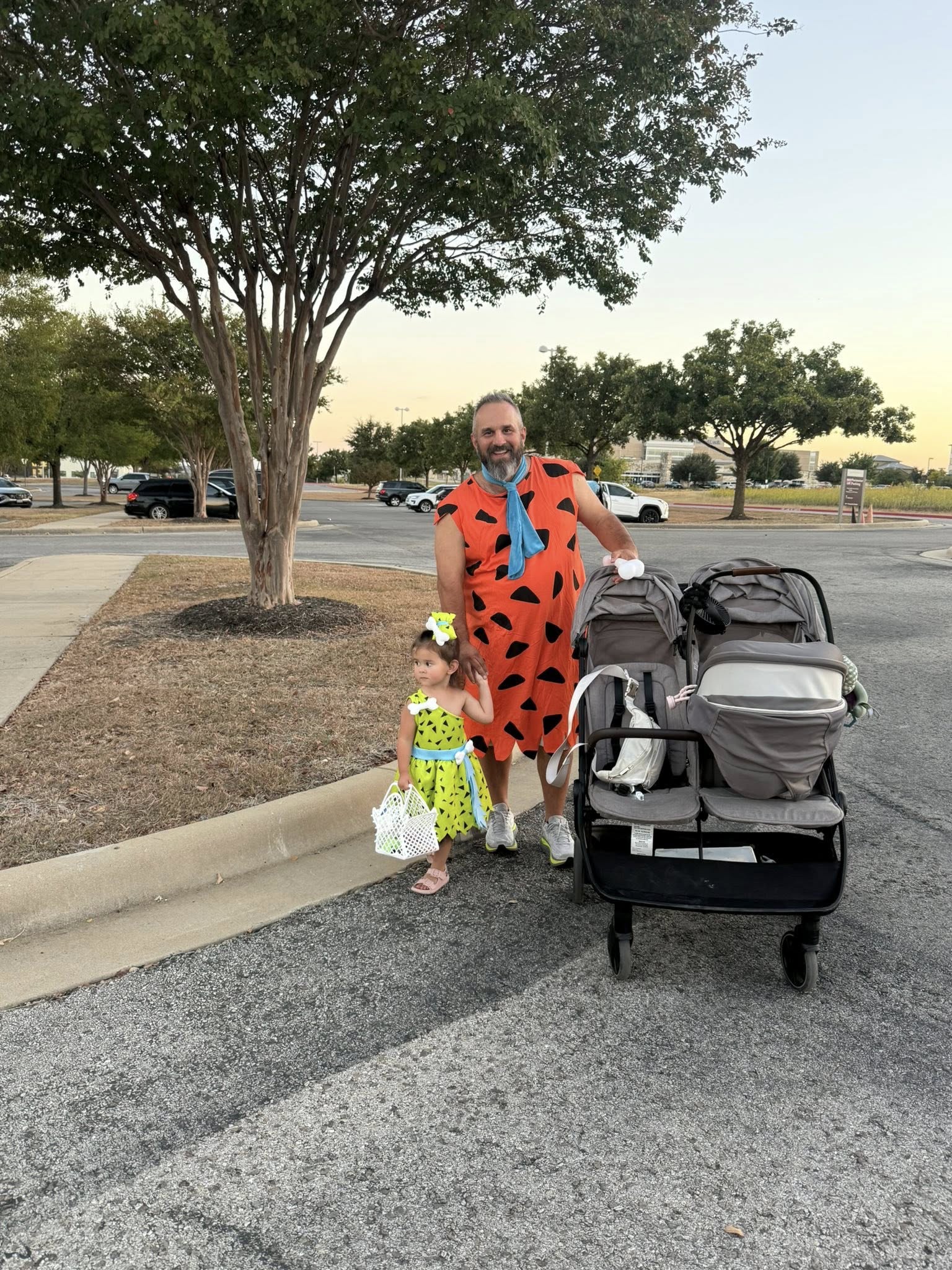 a man with his daughter wearing halloween costumes