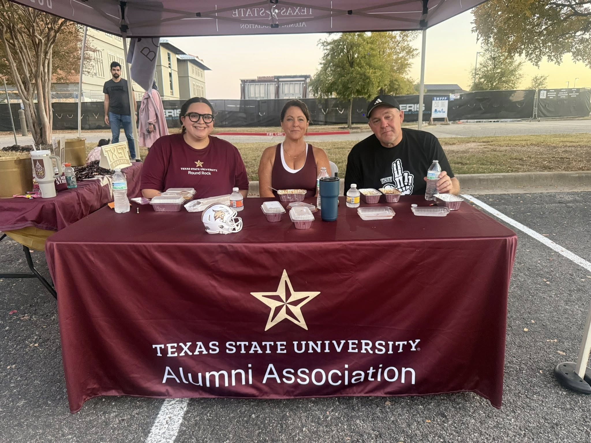a staff sitting at the table