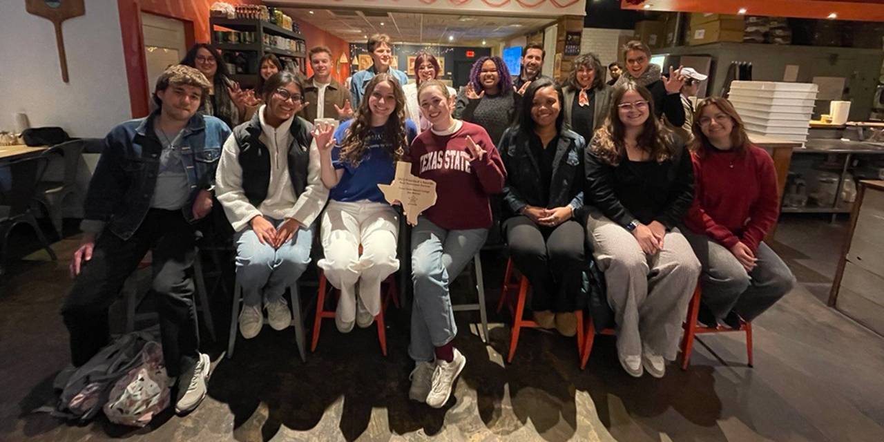 TXST Honors College students and faculty pose for a photo at the celebration dinner.