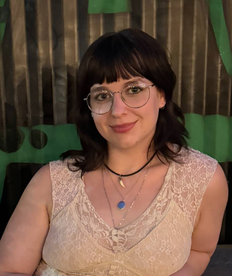 Student sitting wearing glasses 