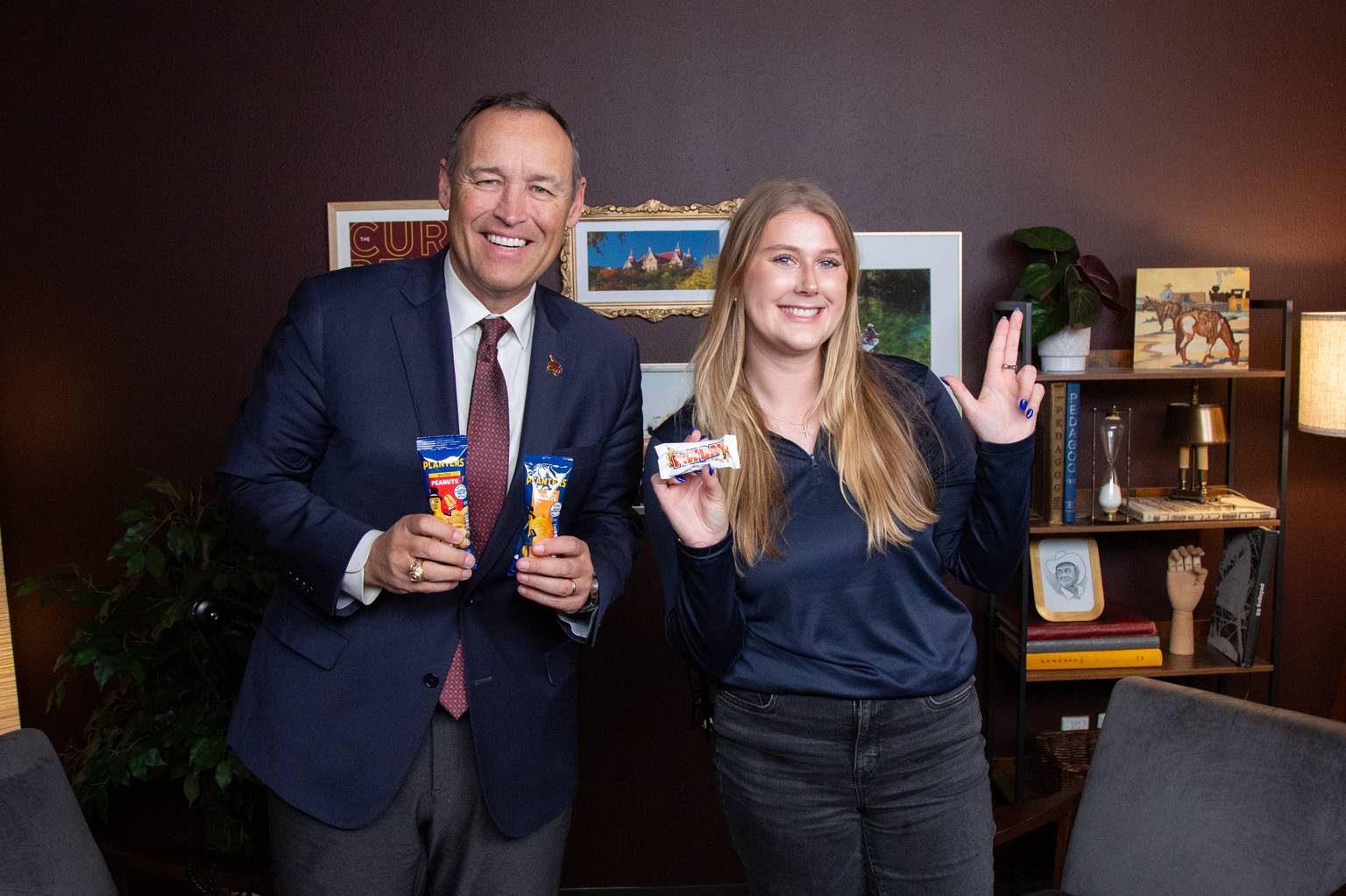 President Damphousse and alum Katie Krupinski, Planters “Peanutter” and driver of the Planters NUTmobile