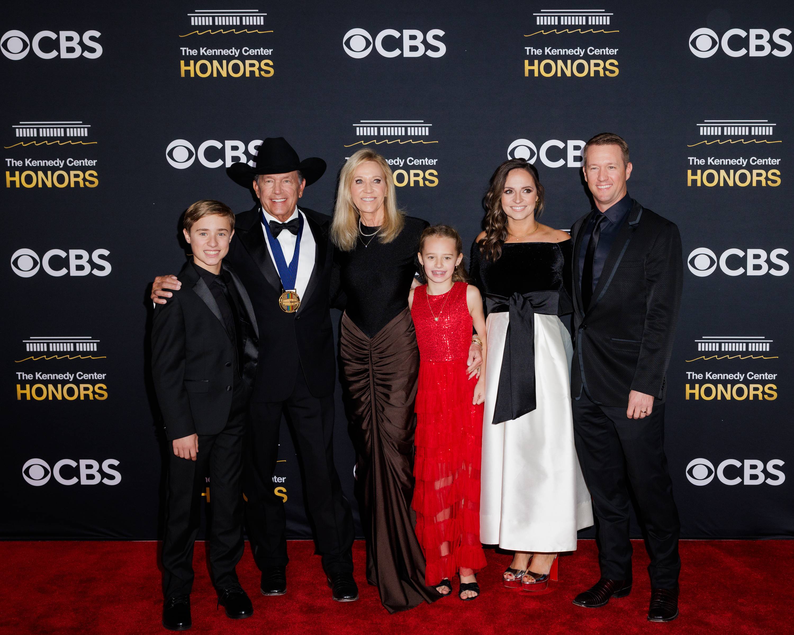 george strait and his family on the red carpet for the Kennedy Center Honors awards show