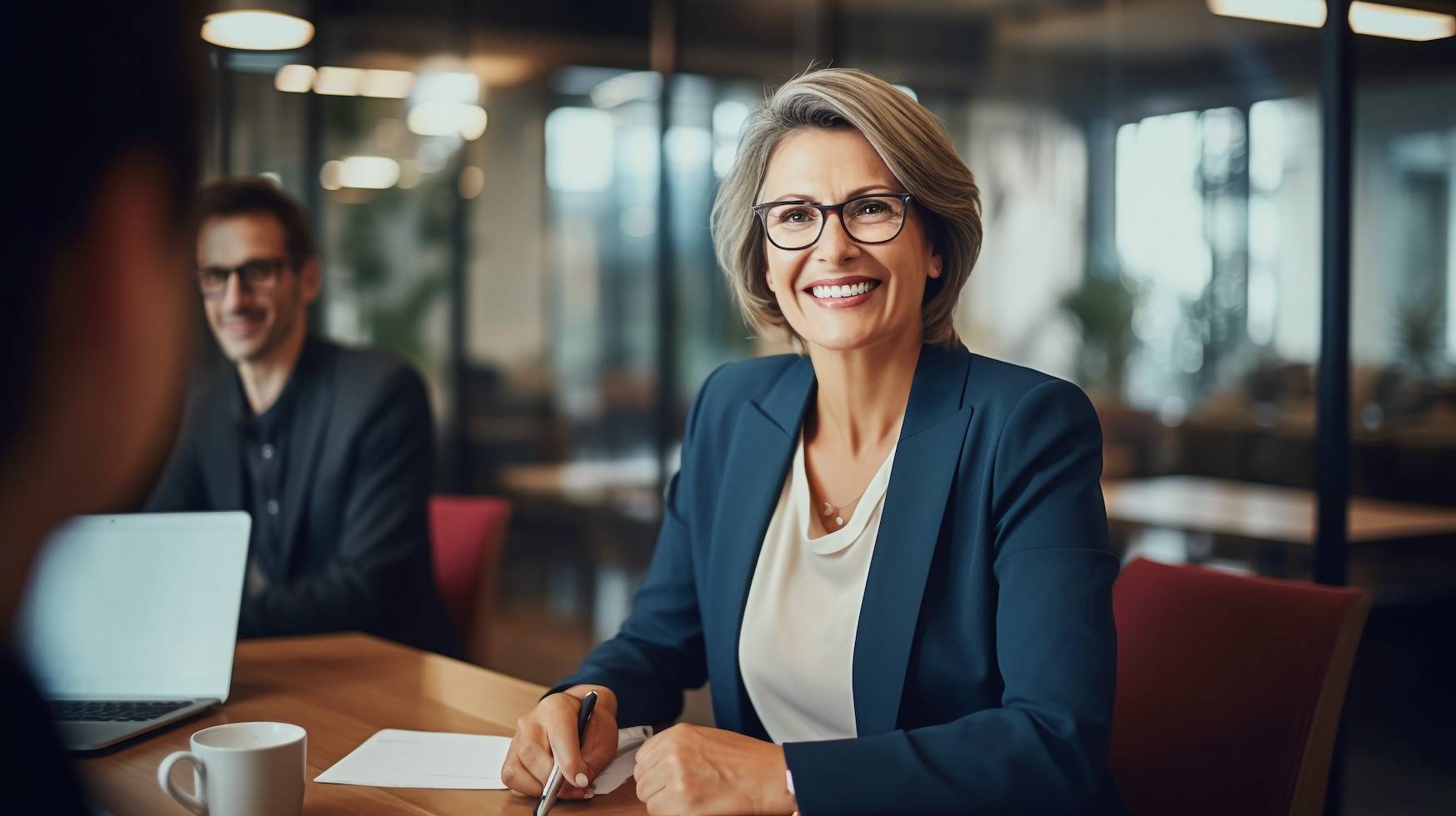 a woman sitting at a desk
