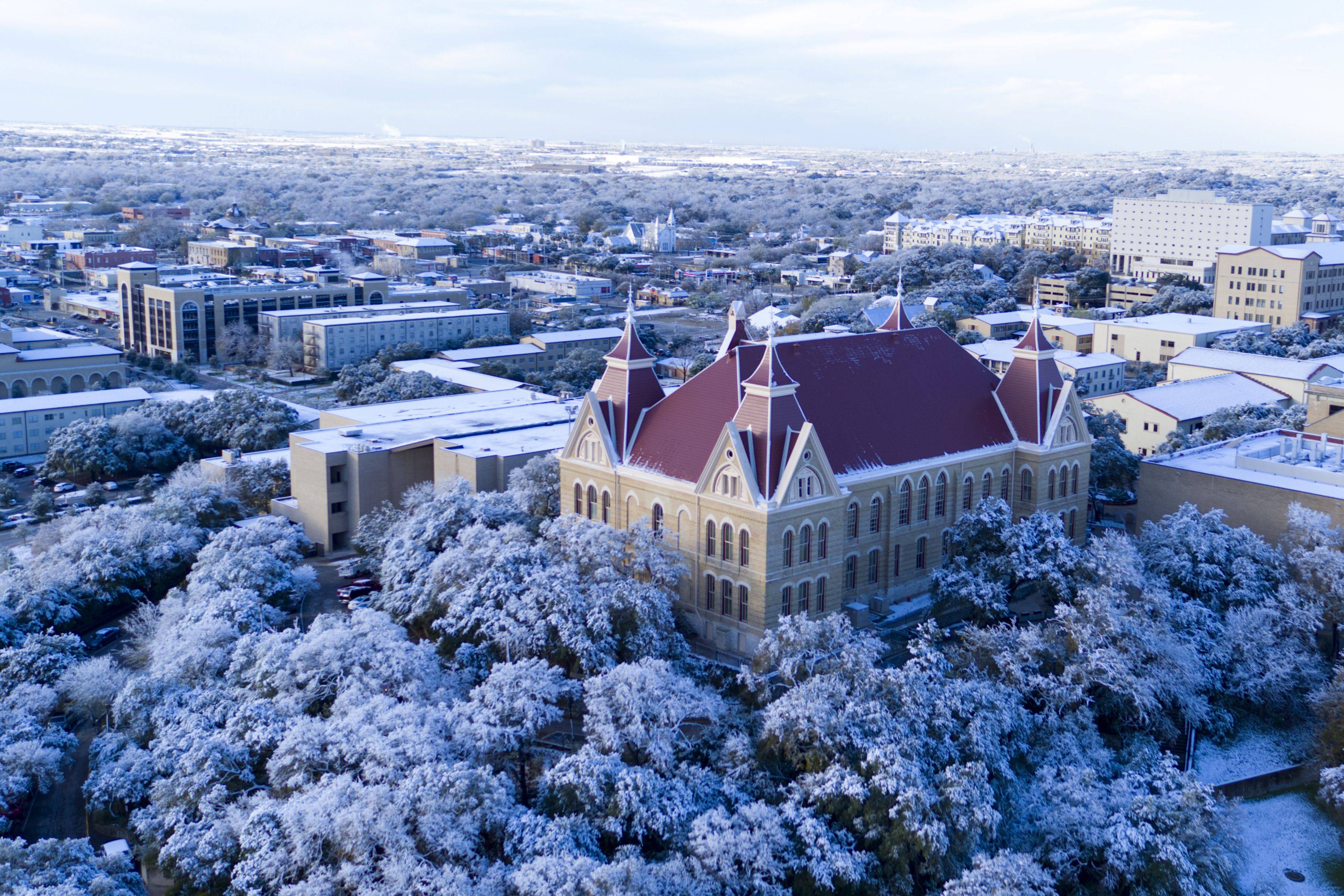 Old Main and the TXST campus covered in snow