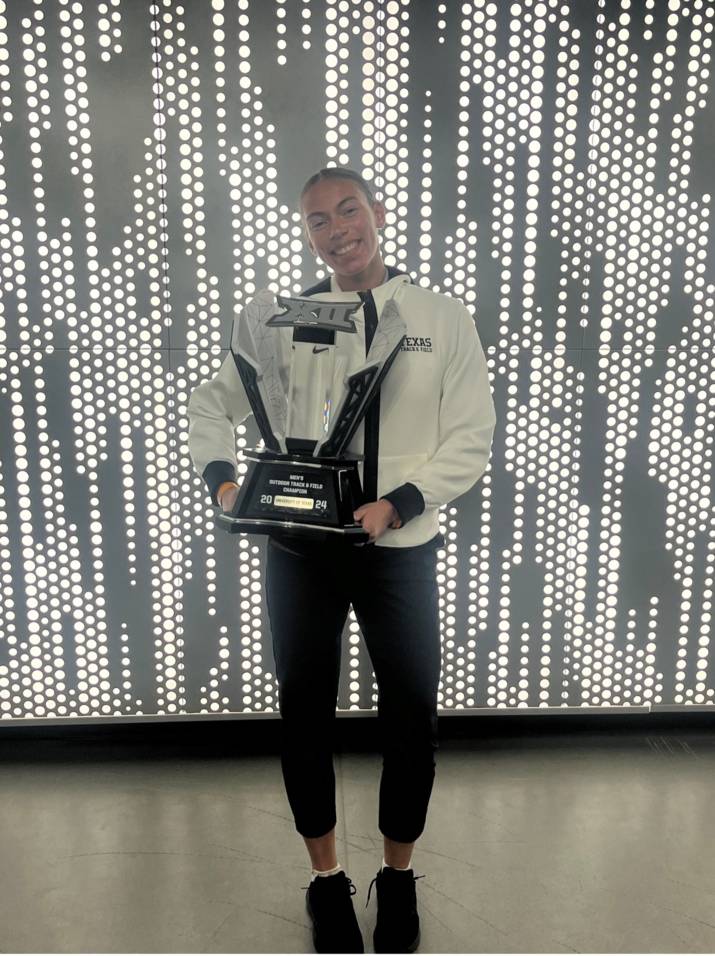 man in blue shirt smiling at camera