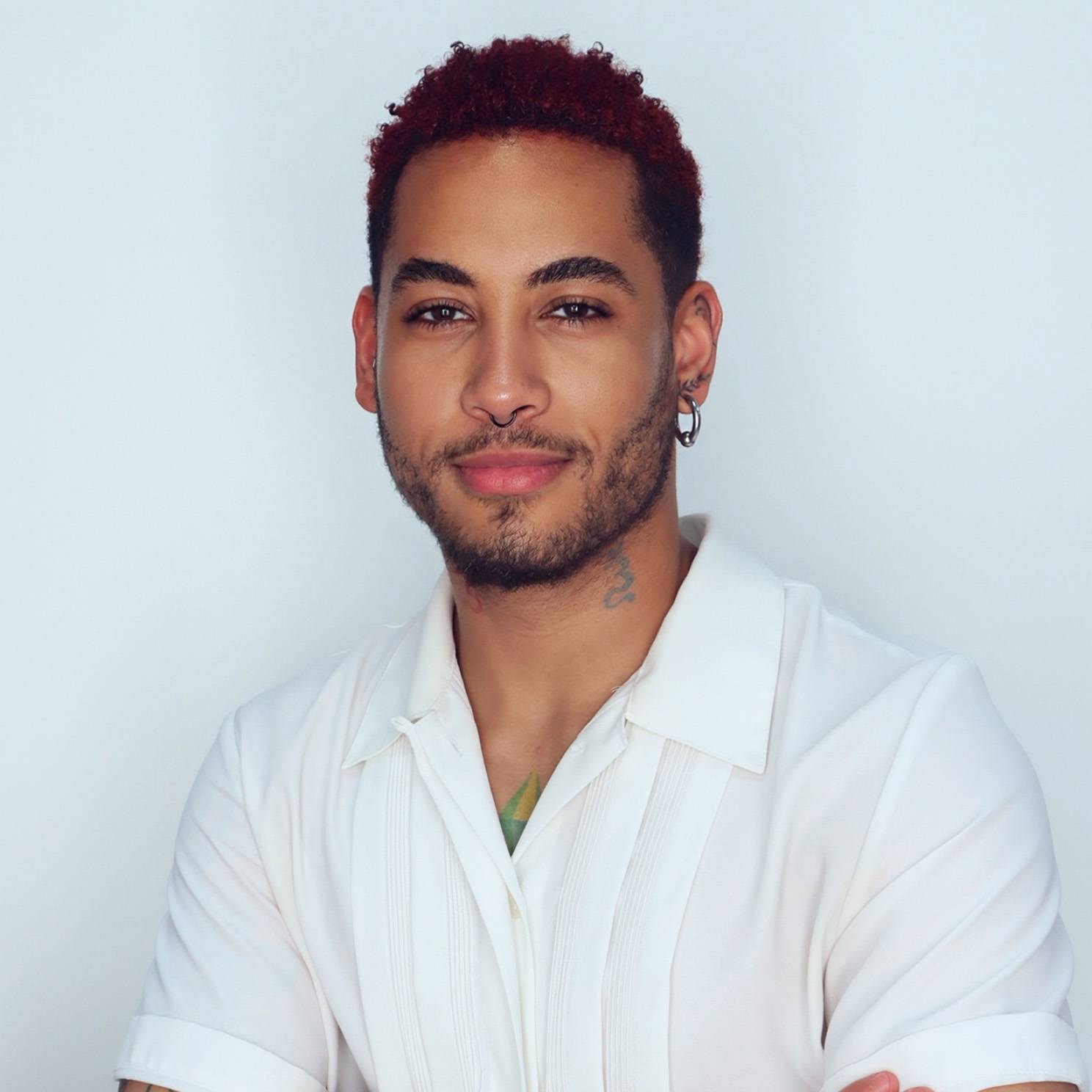 man posing with two alpacas