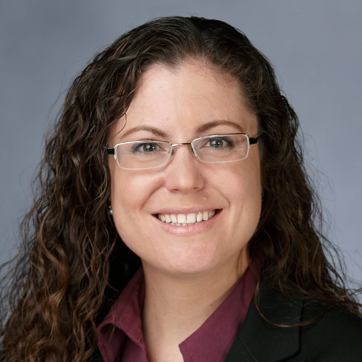 A picture of Dr. Logan Somers smiling