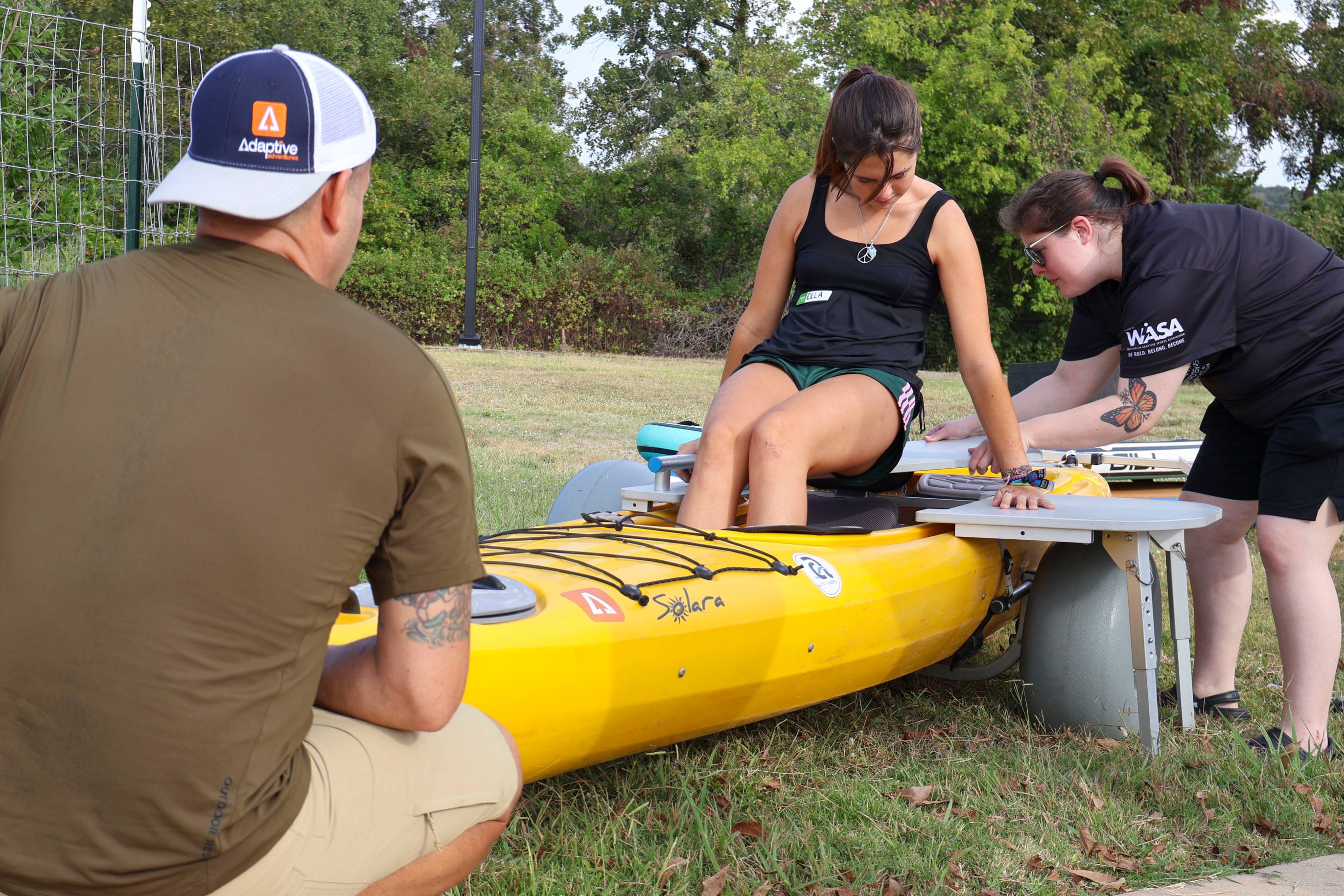 woman getting in kayak