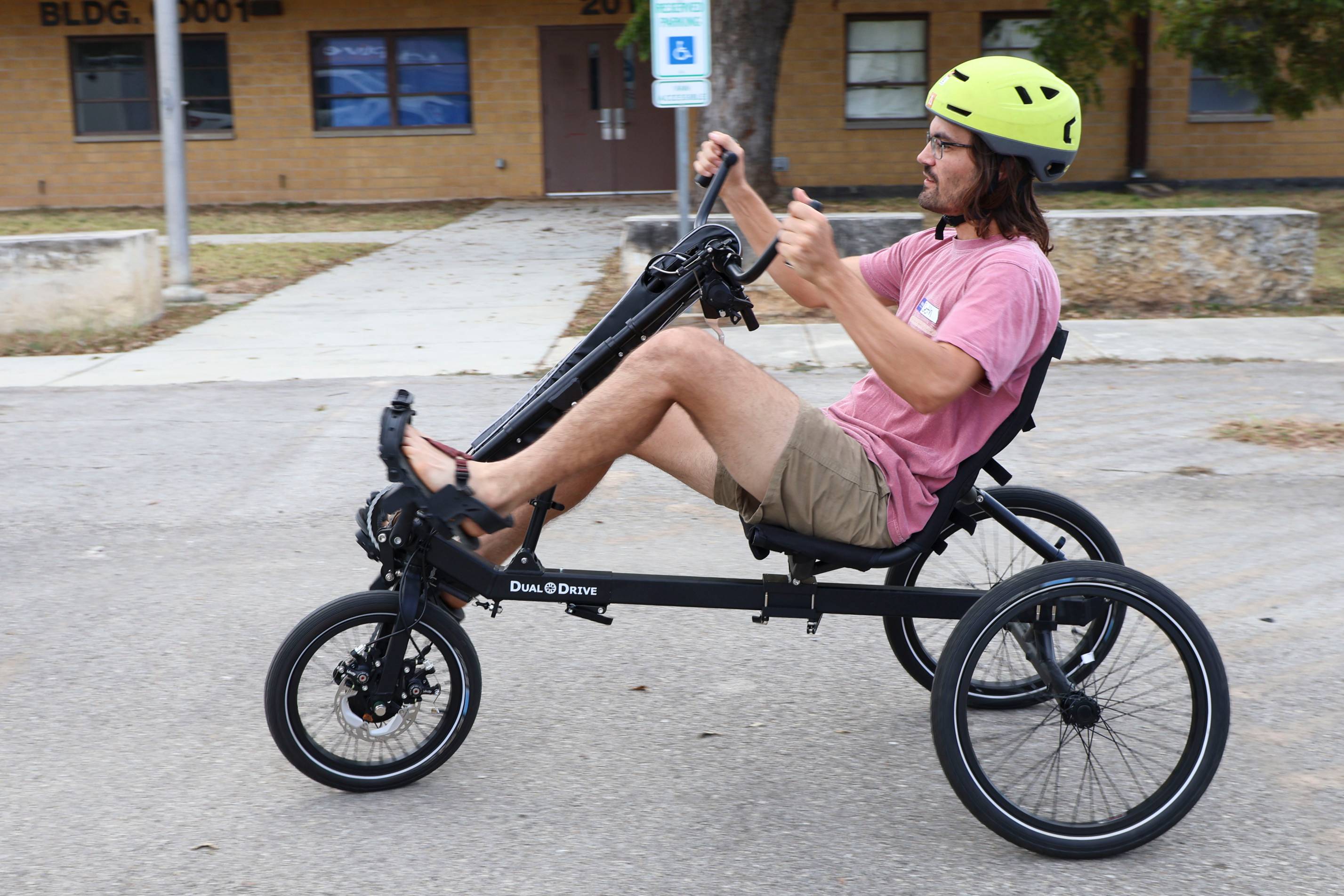 man riding a tricycle