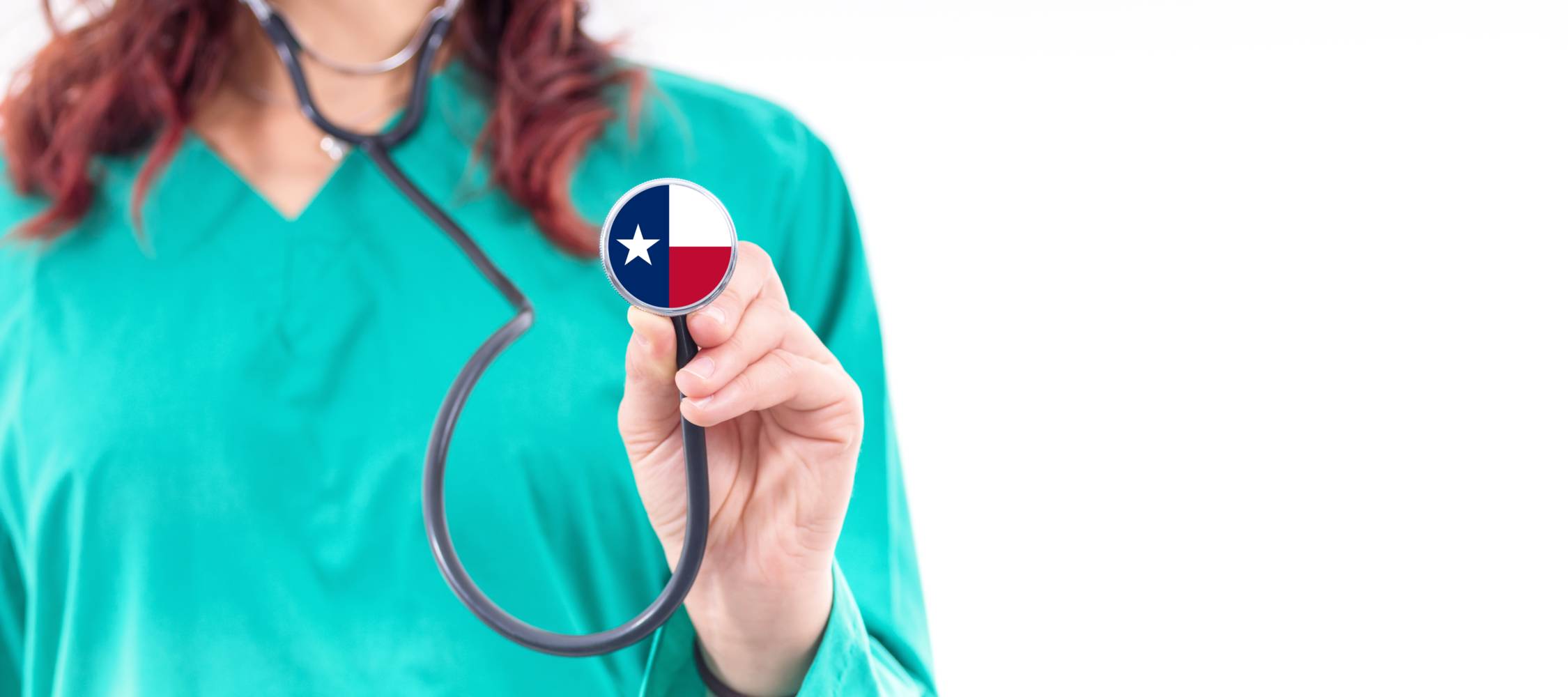 a doctor in green scrubs holding a stethoscope with a state of texas symbol on it