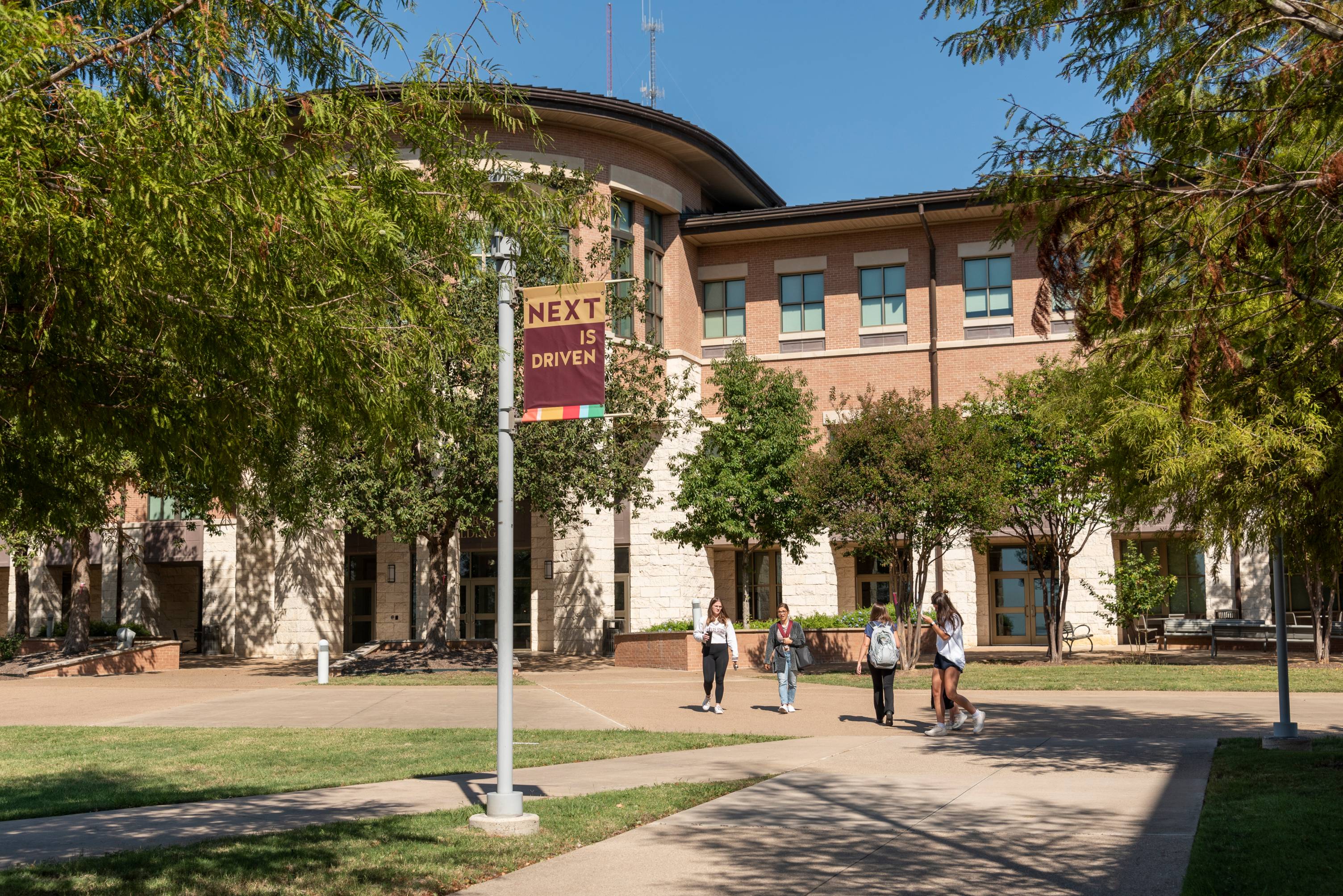 round rock campus with students walking