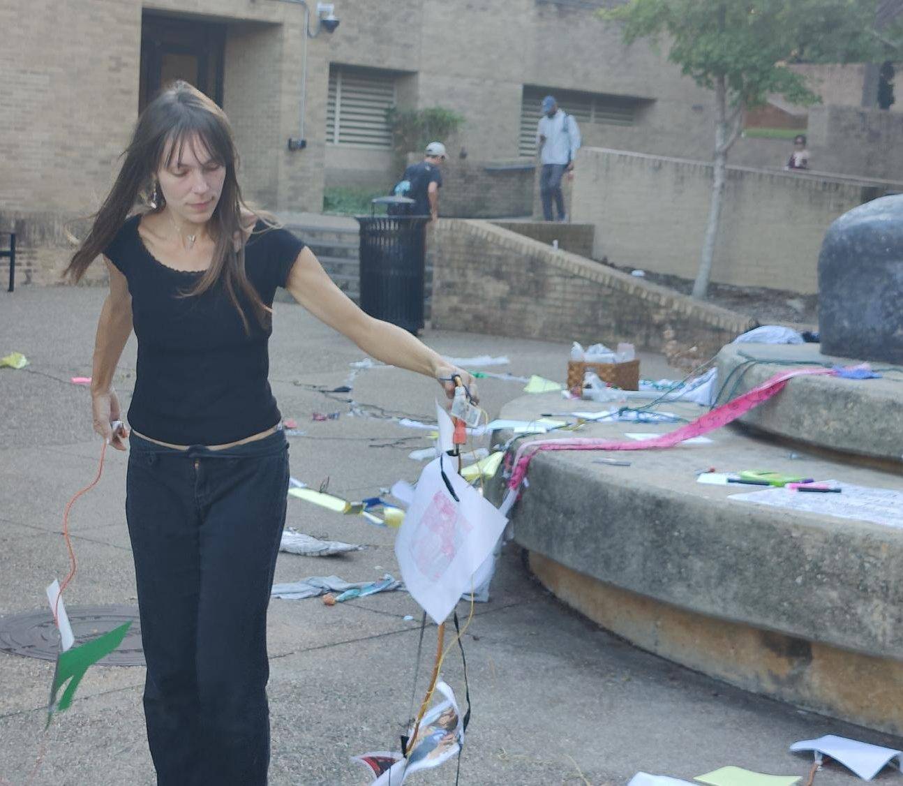 Jessamyn Plotts carrying tendrils of the collage feedback loop she facilitated for a photo