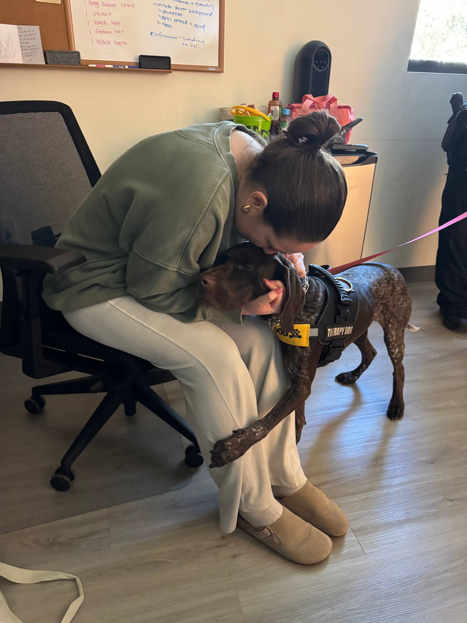 Mando hugging student