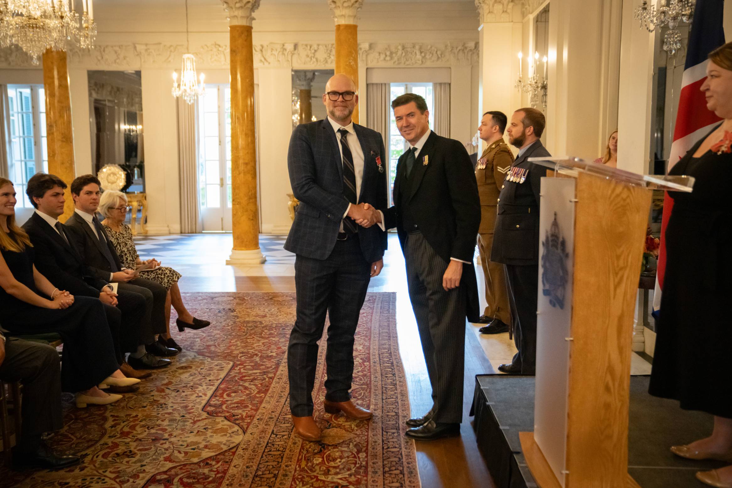Will Wright and Chargé d’Affaires, James Roscoe shaking hands