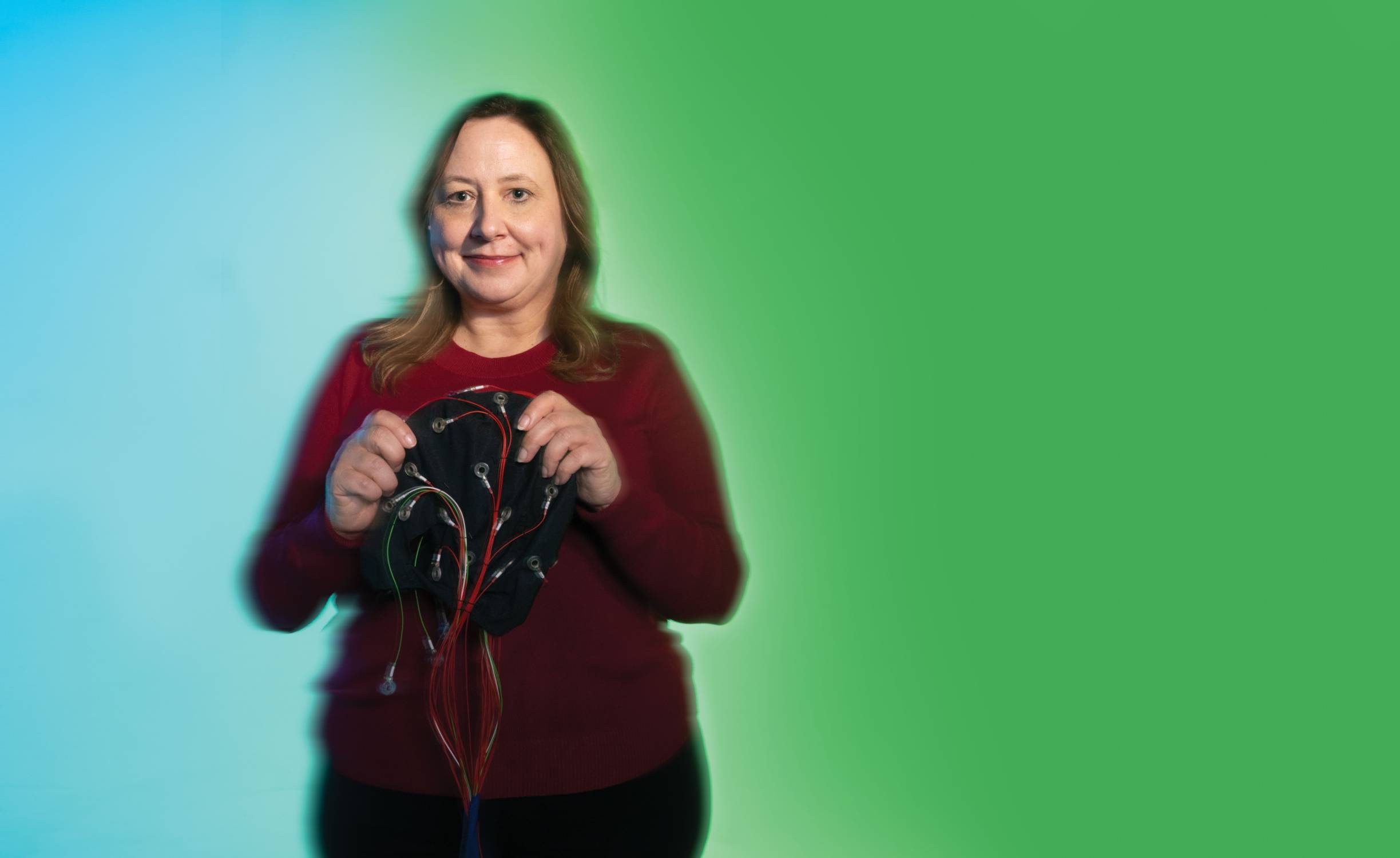 woman holding medical devices used for dementia research