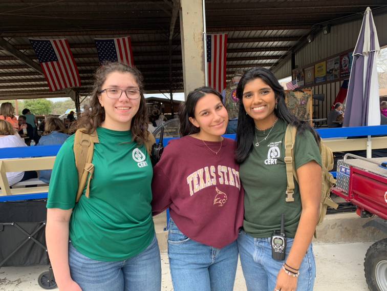 three women pose for photo