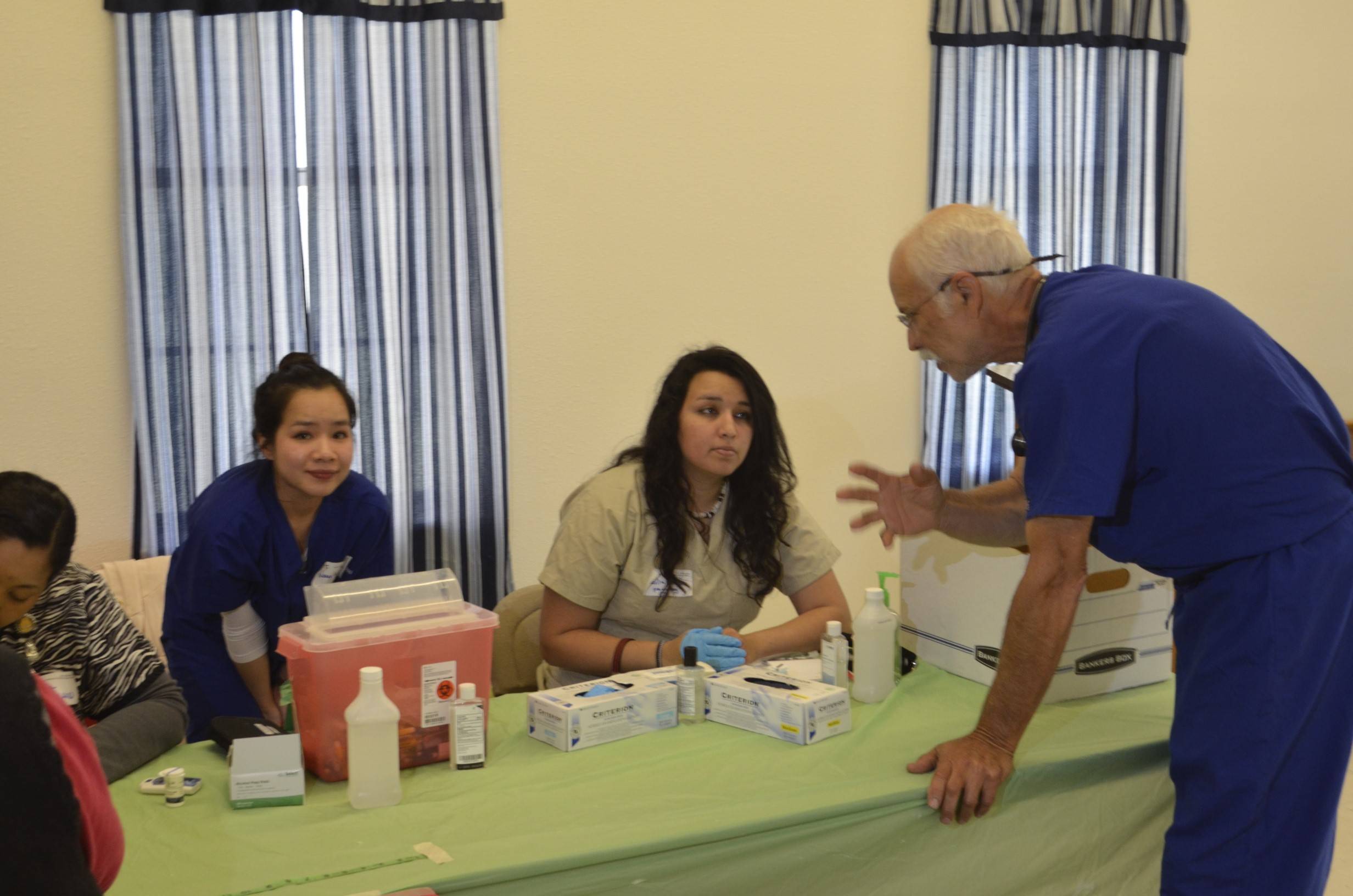 Physician explaining procedures on a medical mission trip.