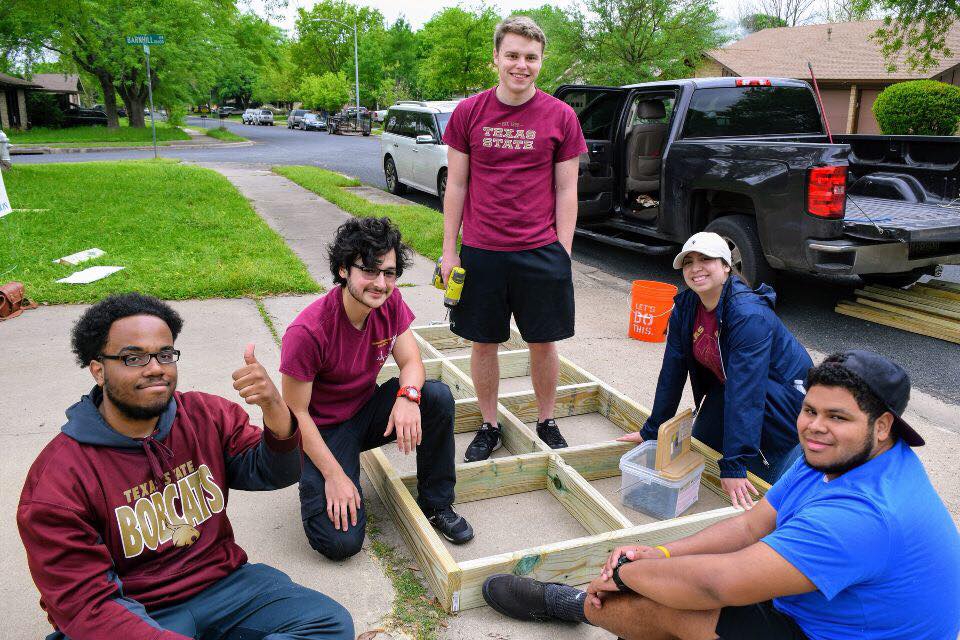 Explorers building a wheelchair ramp