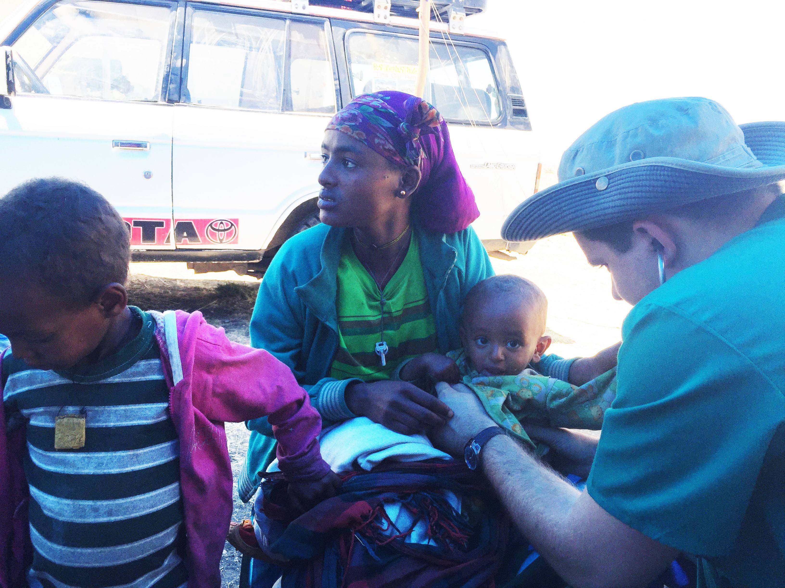 Medical Explorer Nick treating a patient in Ethiopia