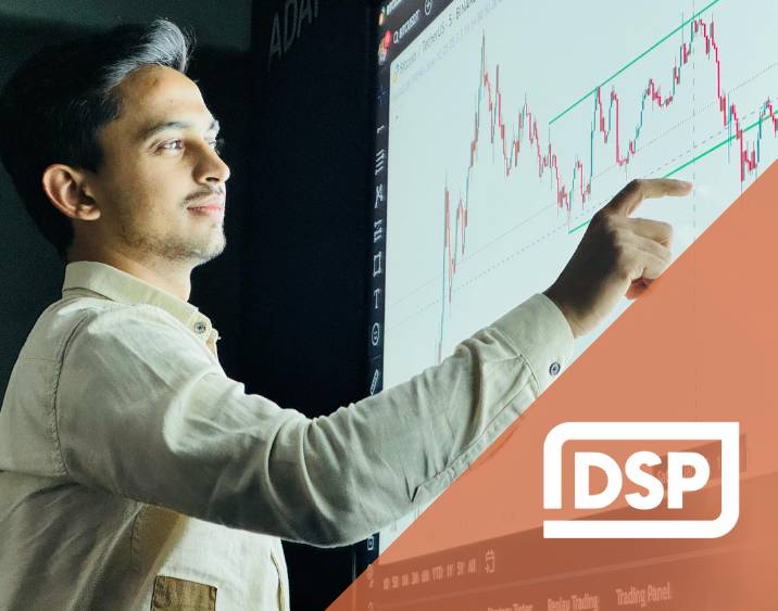 A data scientist points at a computer screen and the Data Science Pathways logo appears in the corner