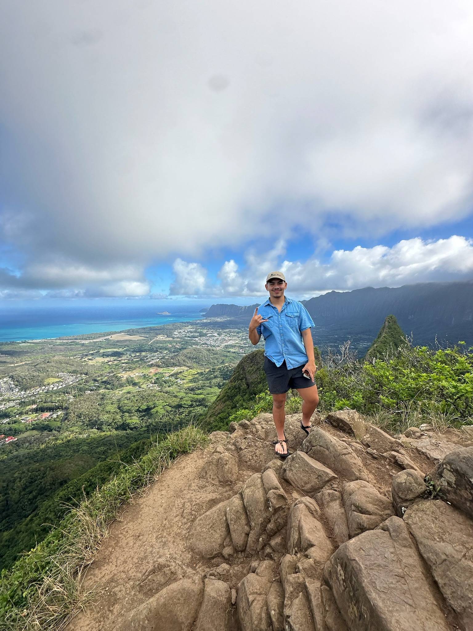 man standing on mountain in hawaii