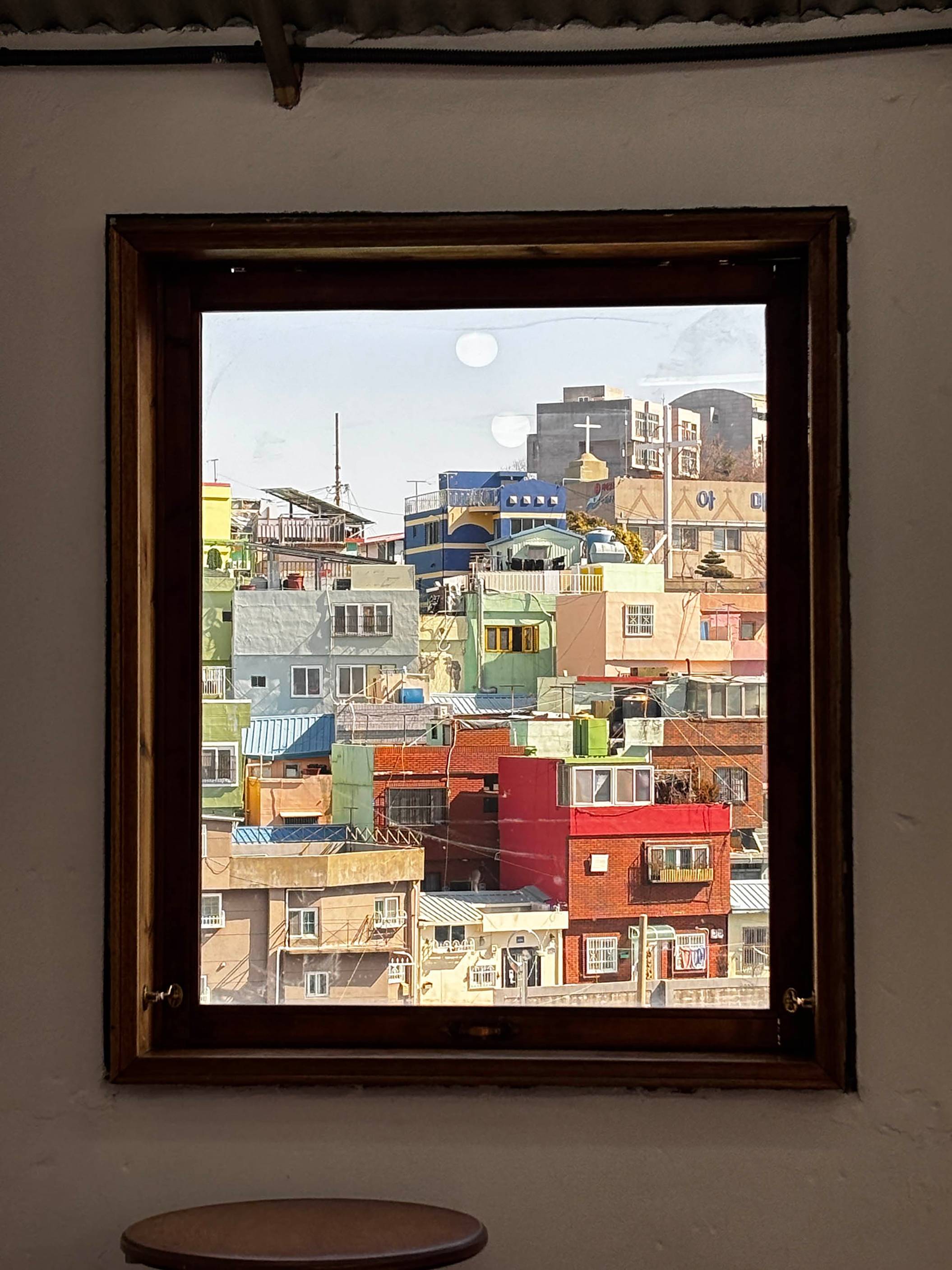 colorful buildings in south korea as seen out of a window