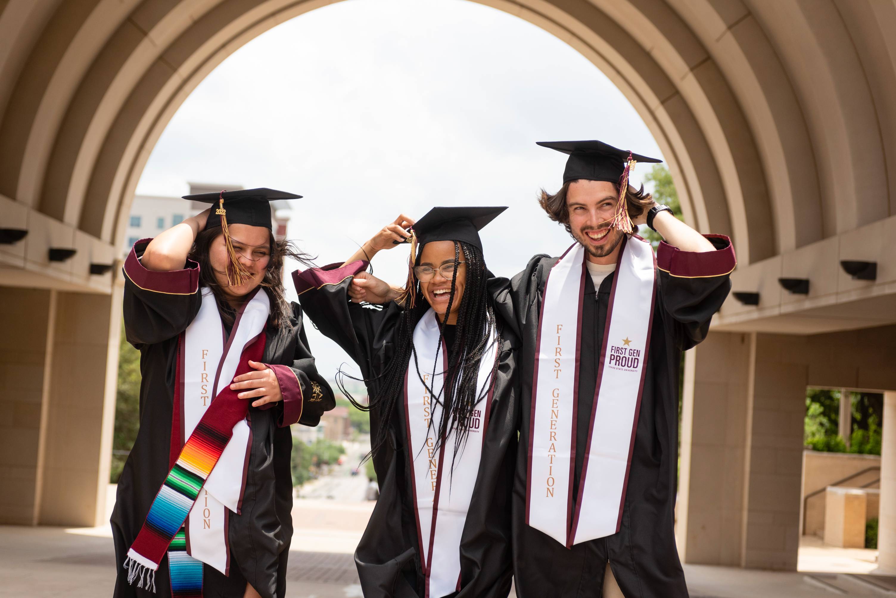 txst graduates in caps and gowns