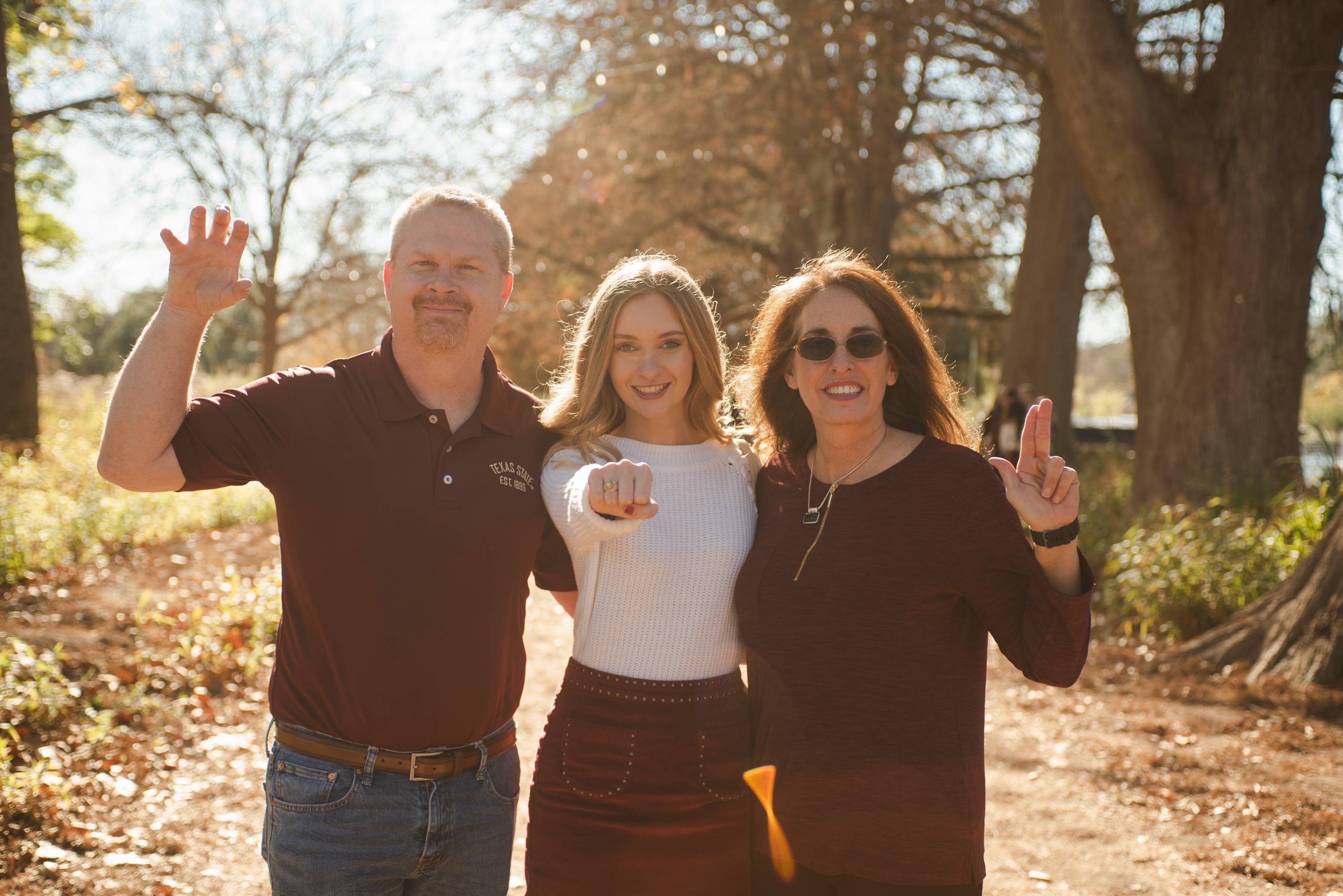 Family posing outside