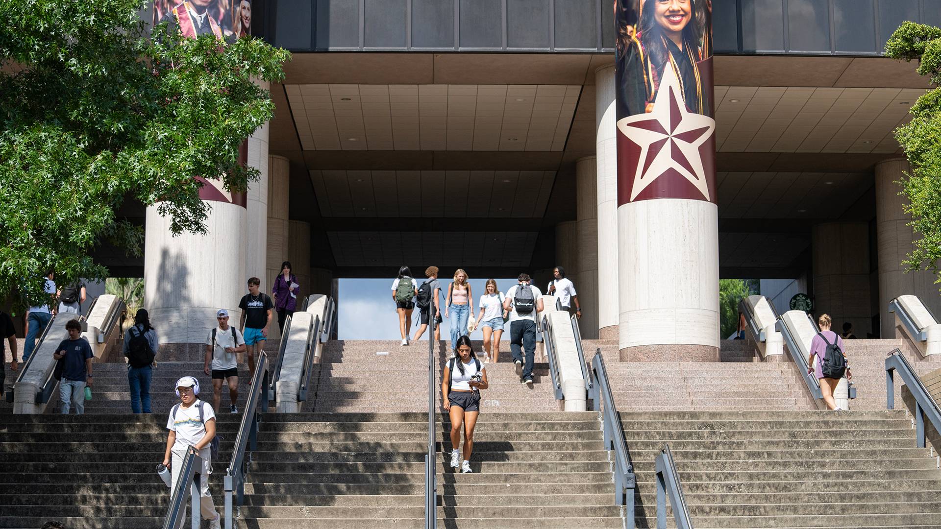 students walking down stairs 